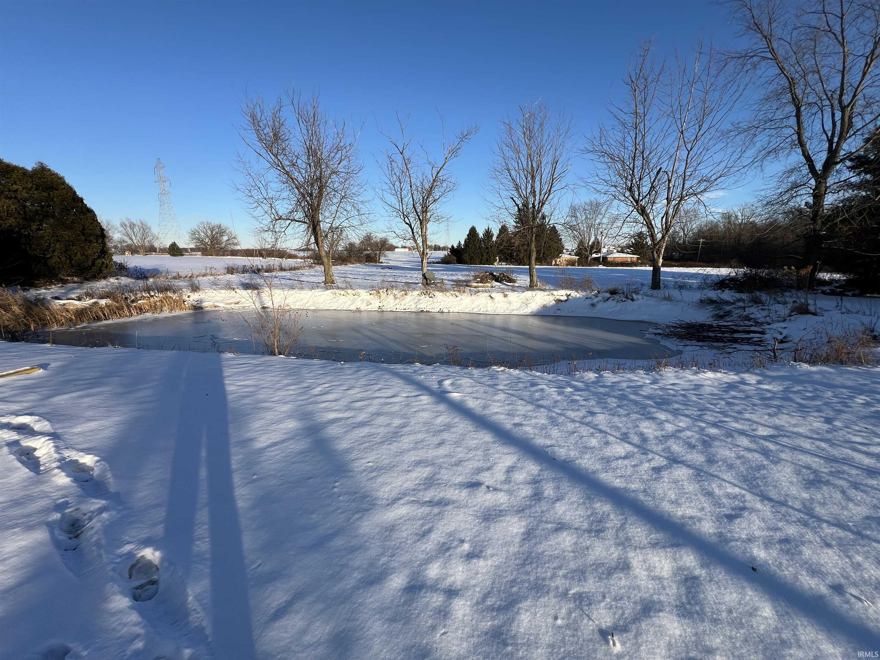 View of pond layered in snow