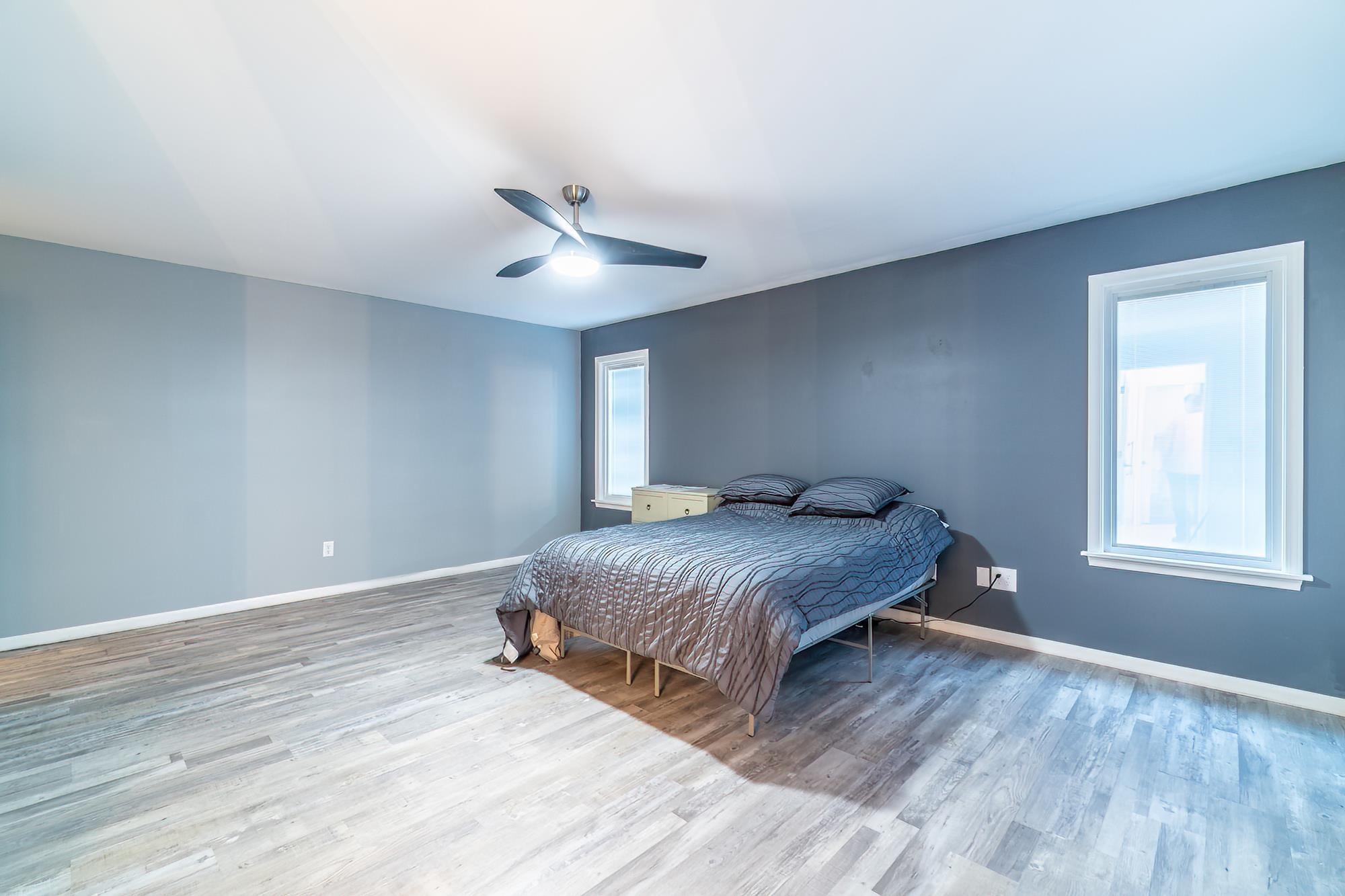 Bedroom featuring light wood-style floors and a ceiling fan