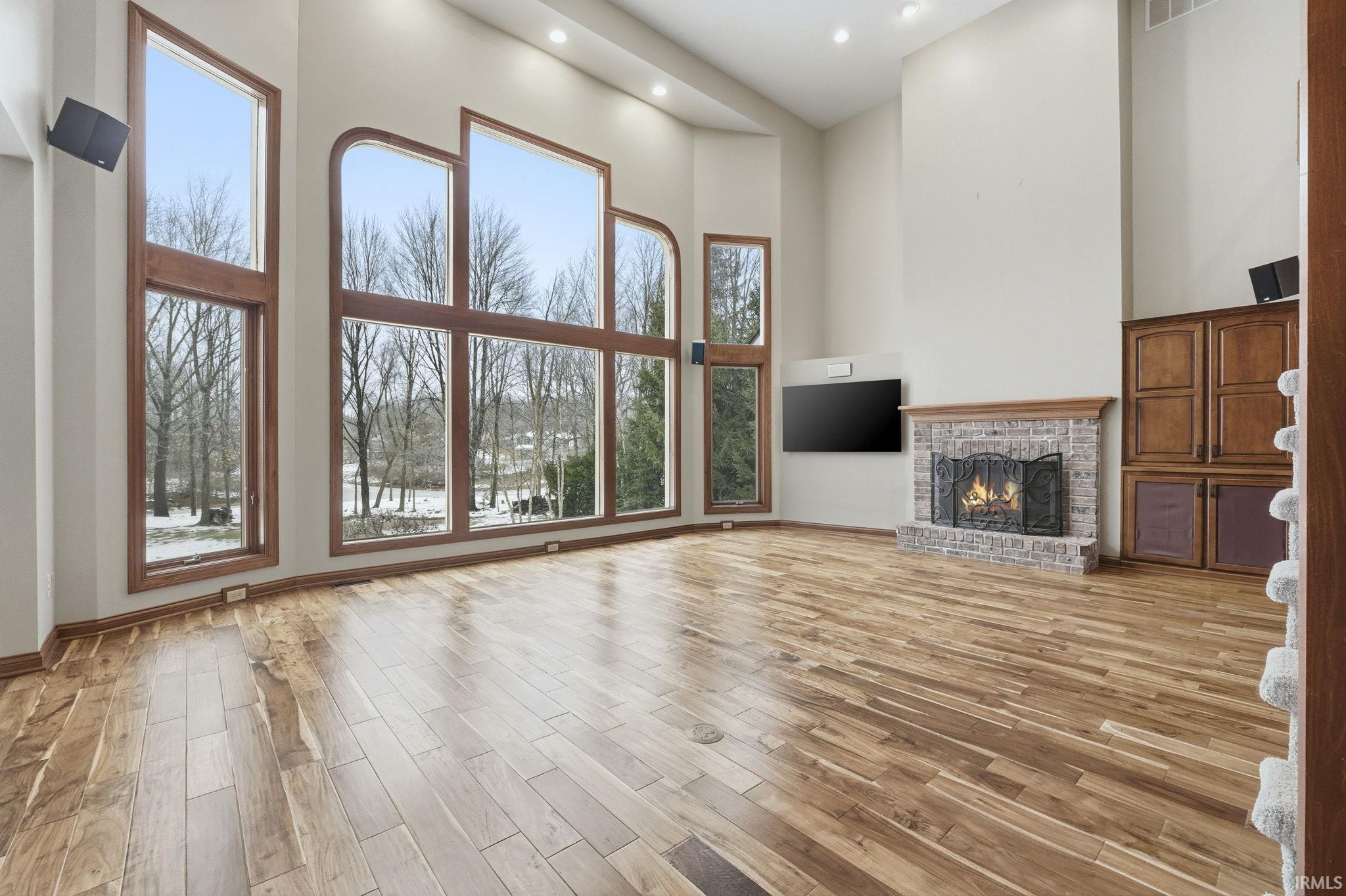 Gas Fireplace, Floor to Ceiling Windows (replaced 2017), Engineered Hardwood over entire main level (2019)