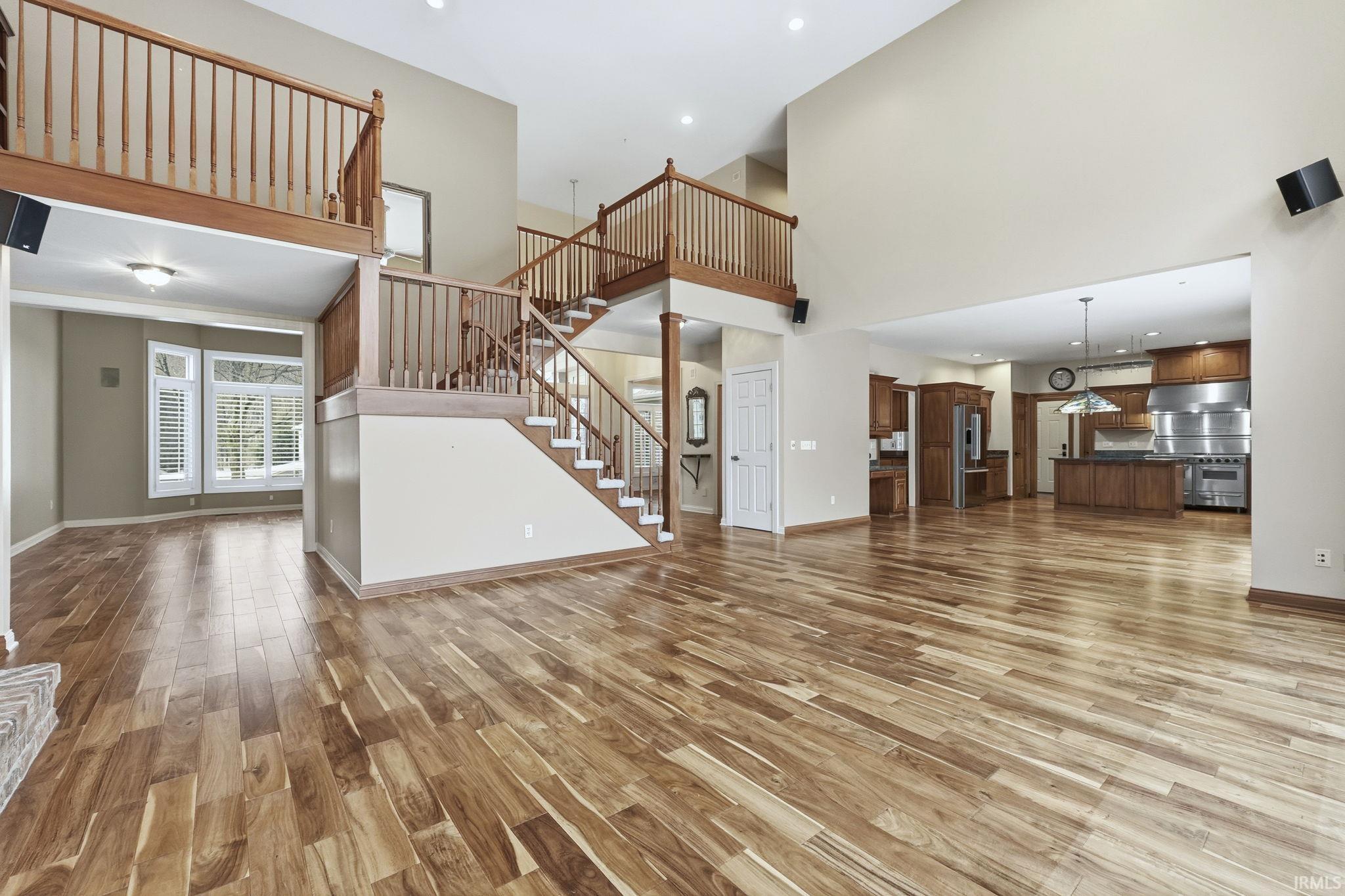 Engineered Hardwood (2019) flows through entire main level, open stairway with reading loft,  soaring ceiling, and recessed lighting