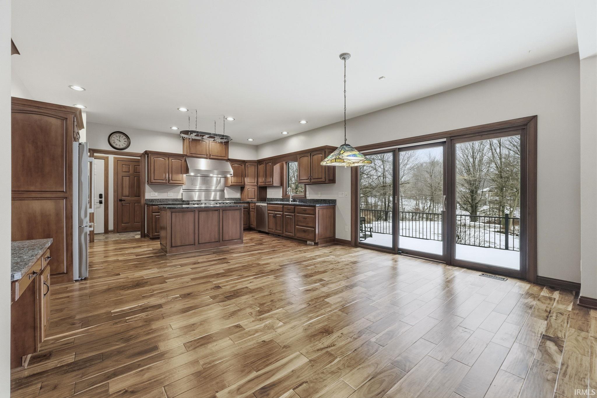 Gourmet, Chef's Kitchen with Hanging Pot Rack and Cherry Cabinetry