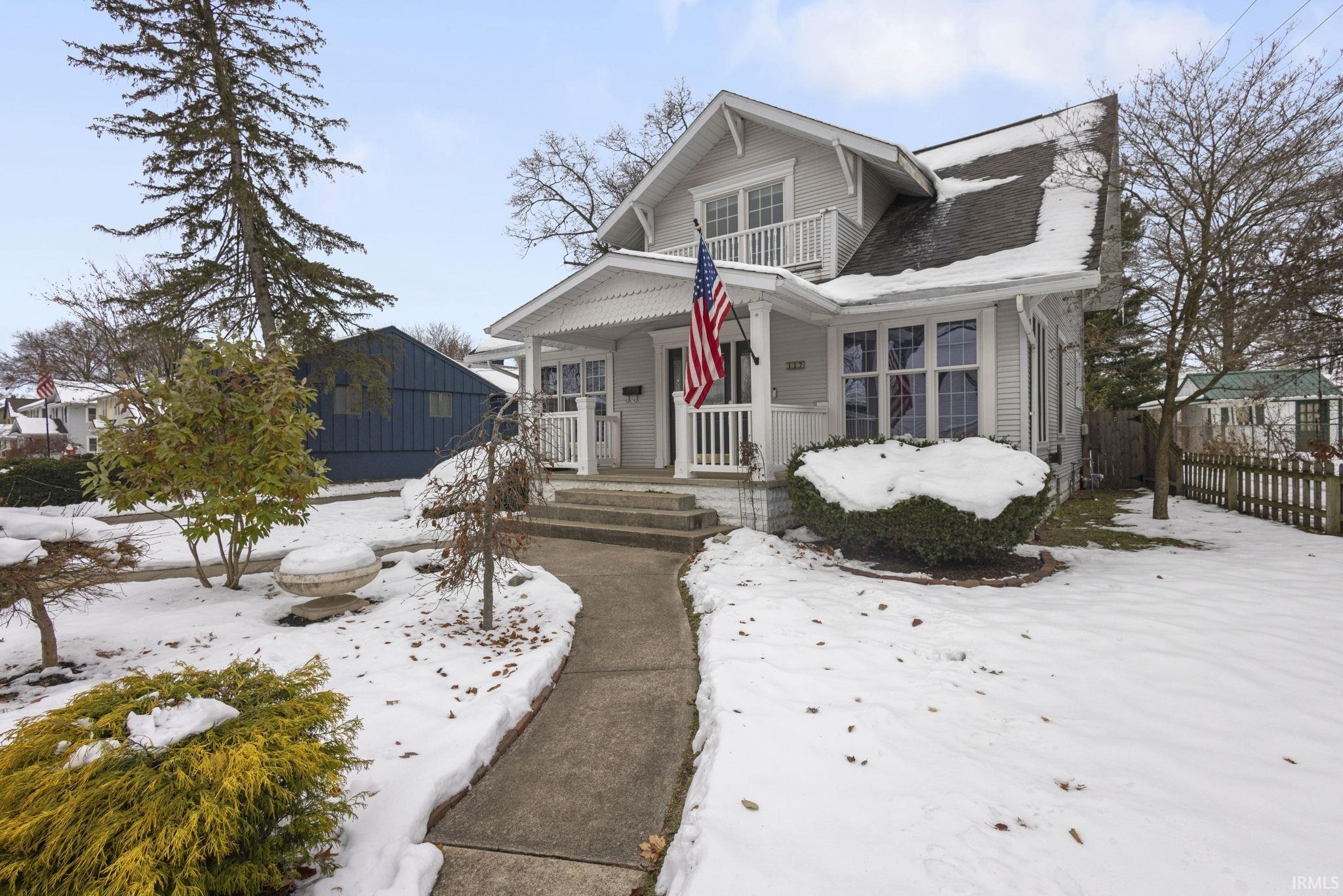 View of front of home featuring covered porch