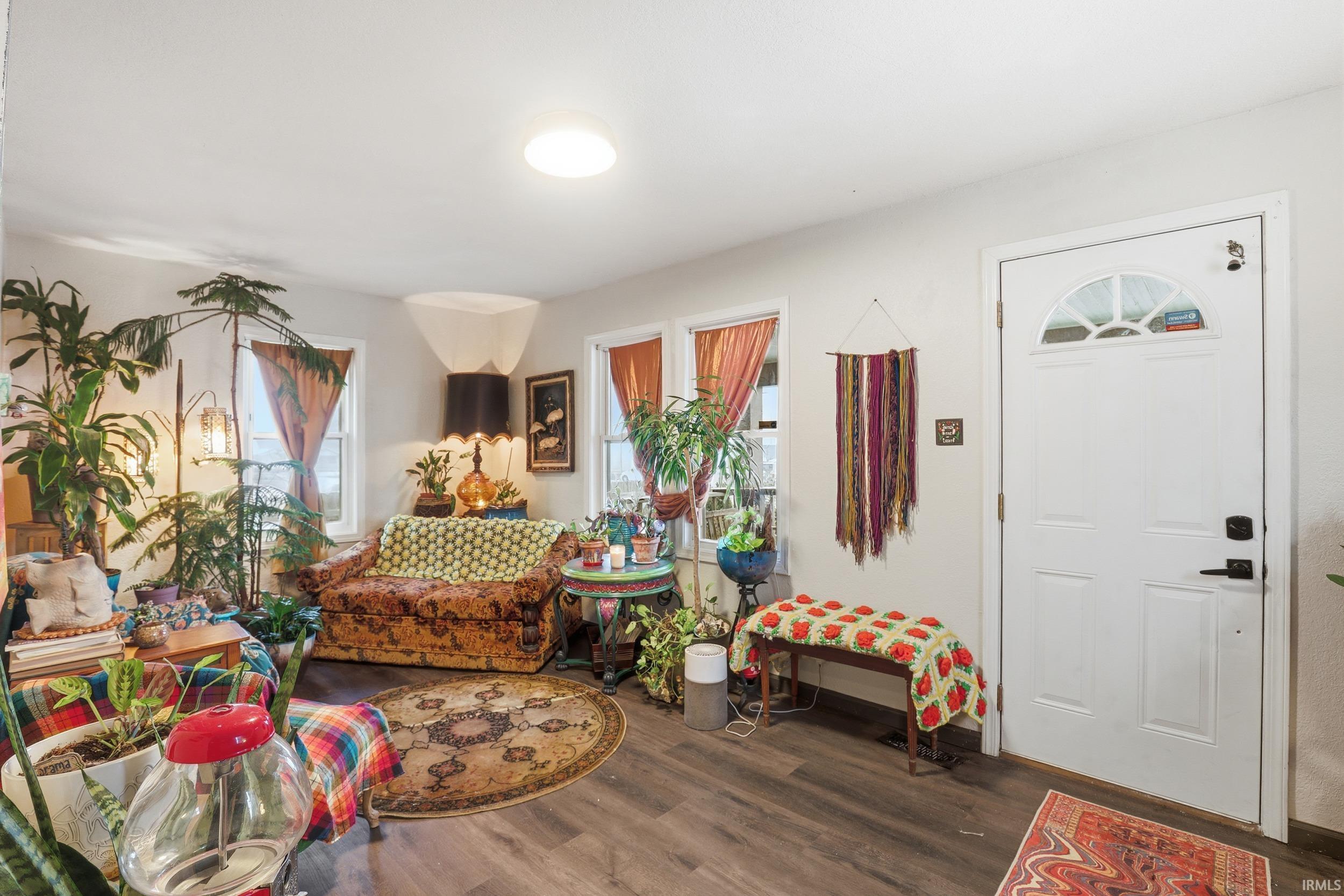 Entrance foyer with dark wood-style floors