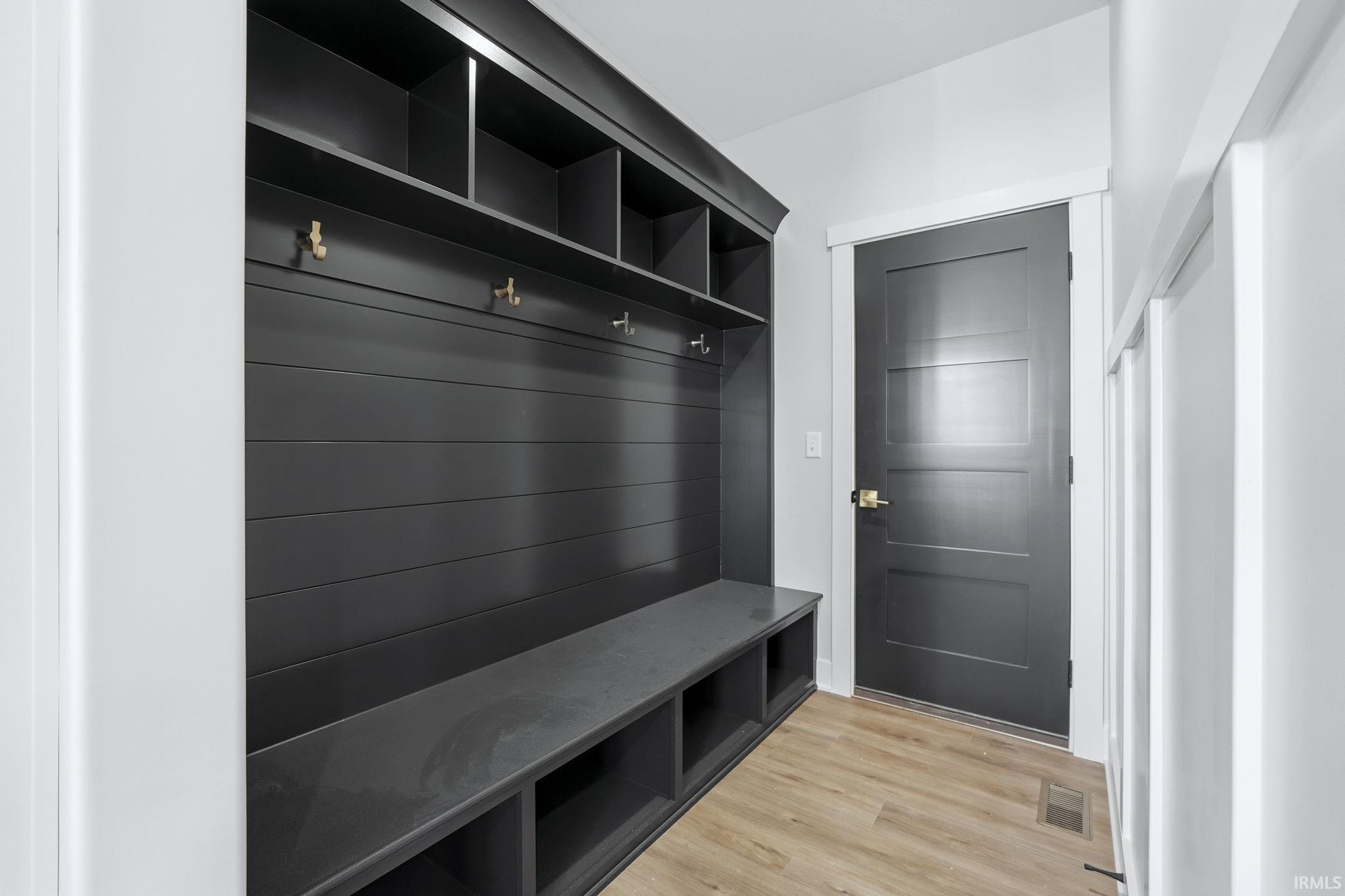 Mudroom with light wood finished floors