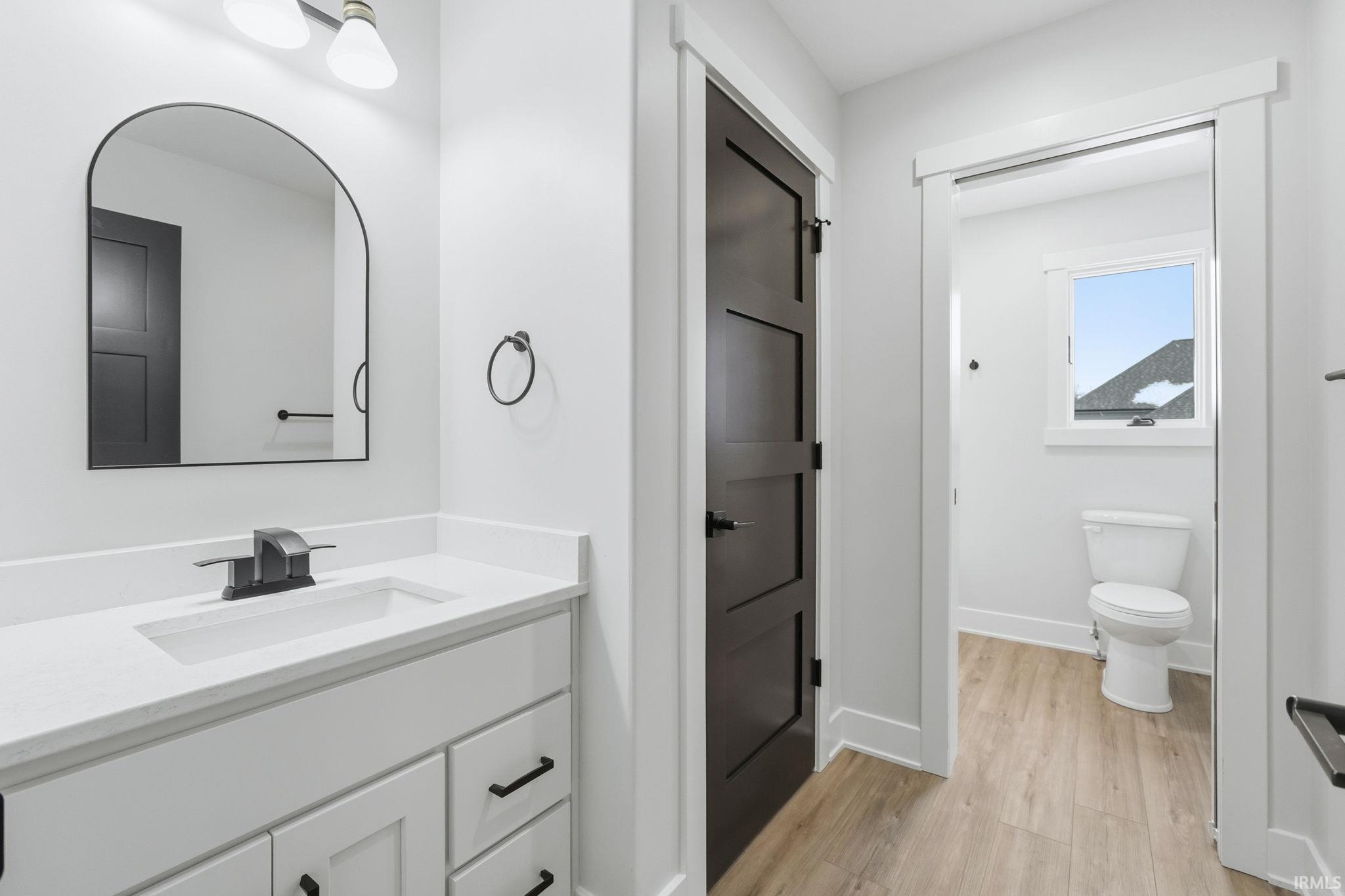 Bathroom featuring vanity and light wood-style flooring