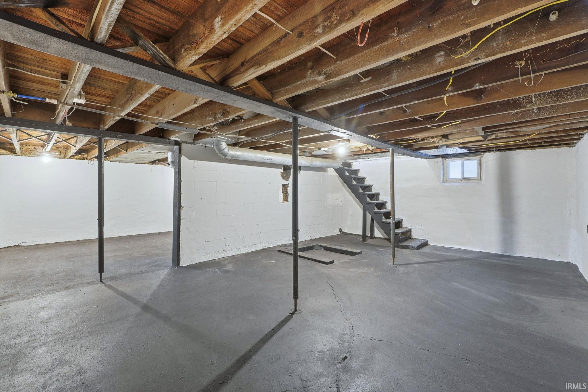 Below grade area featuring stairway