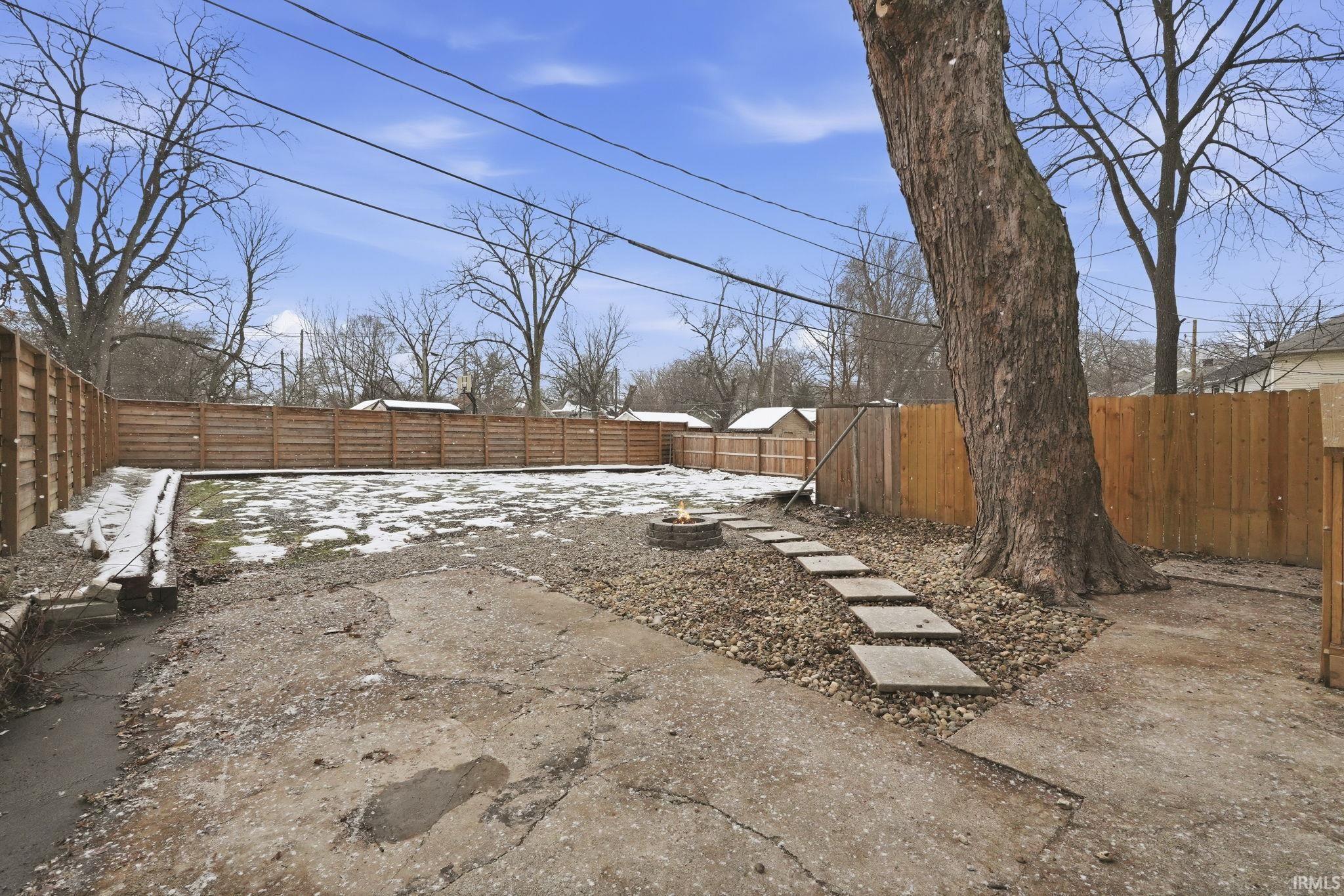 View of fenced backyard