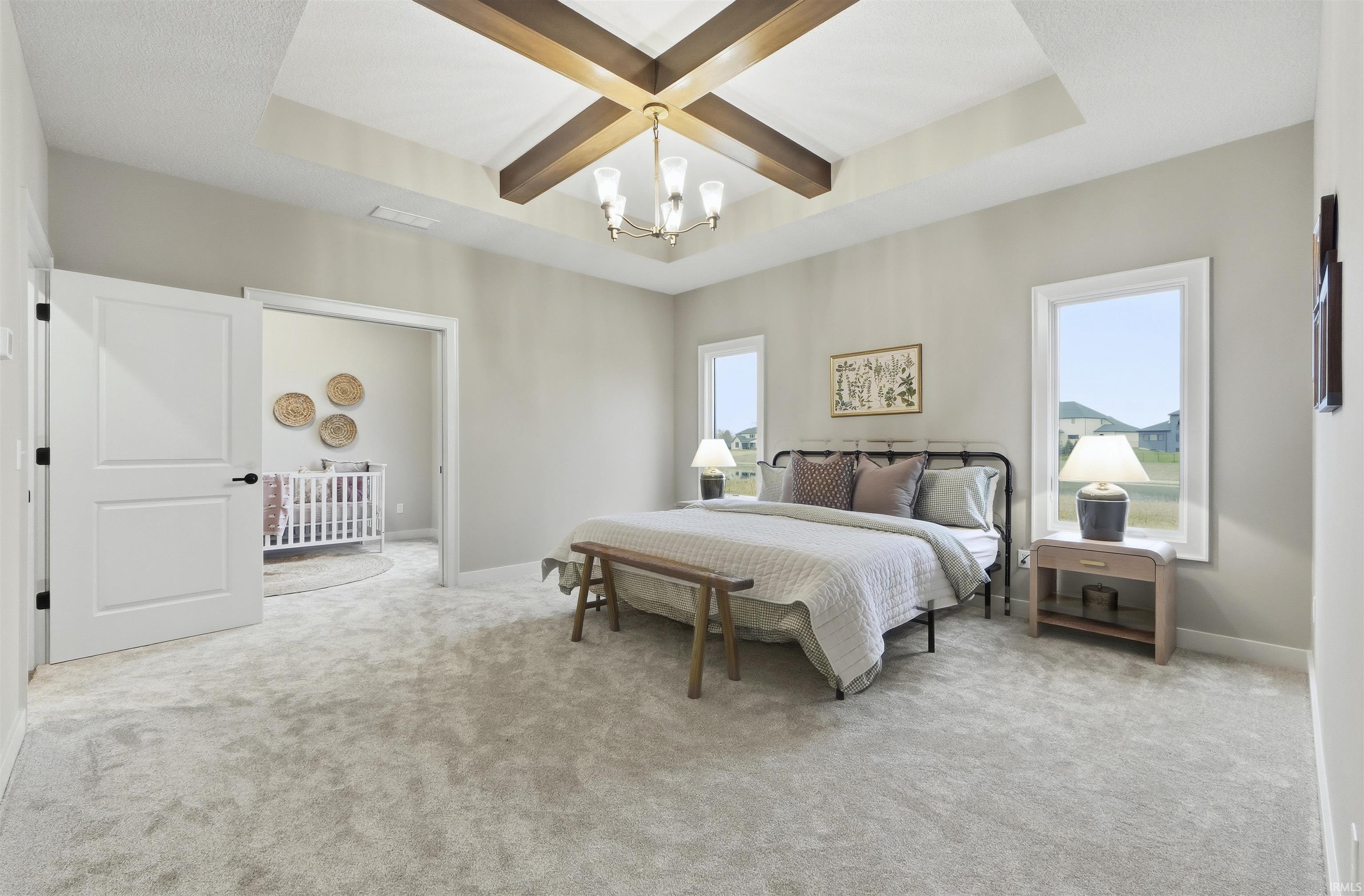 Bedroom with coffered ceiling, light colored carpet, beam ceiling, and a chandelier