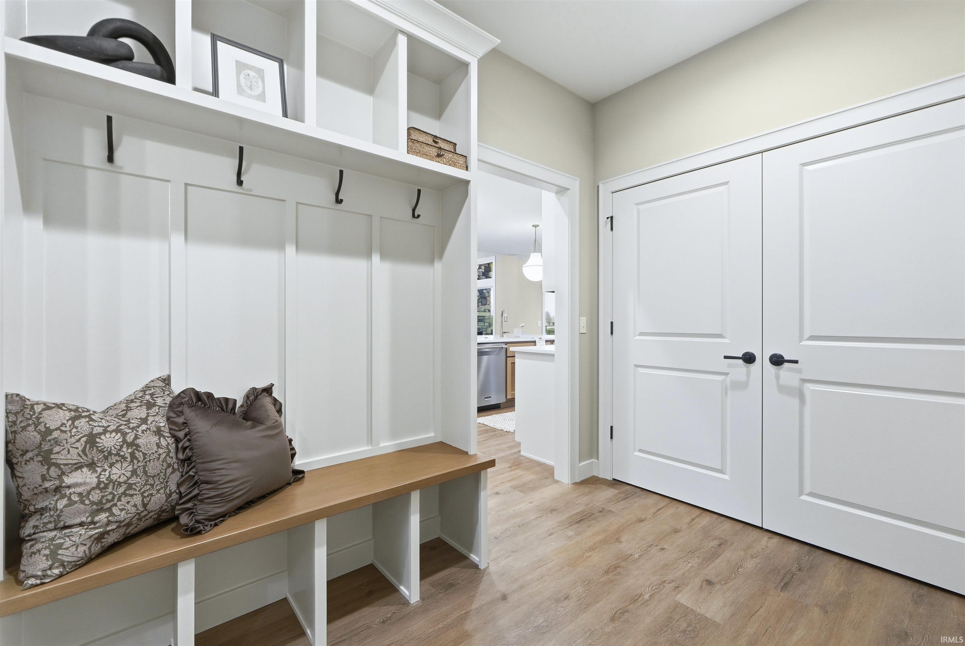 Mudroom featuring light wood-style flooring