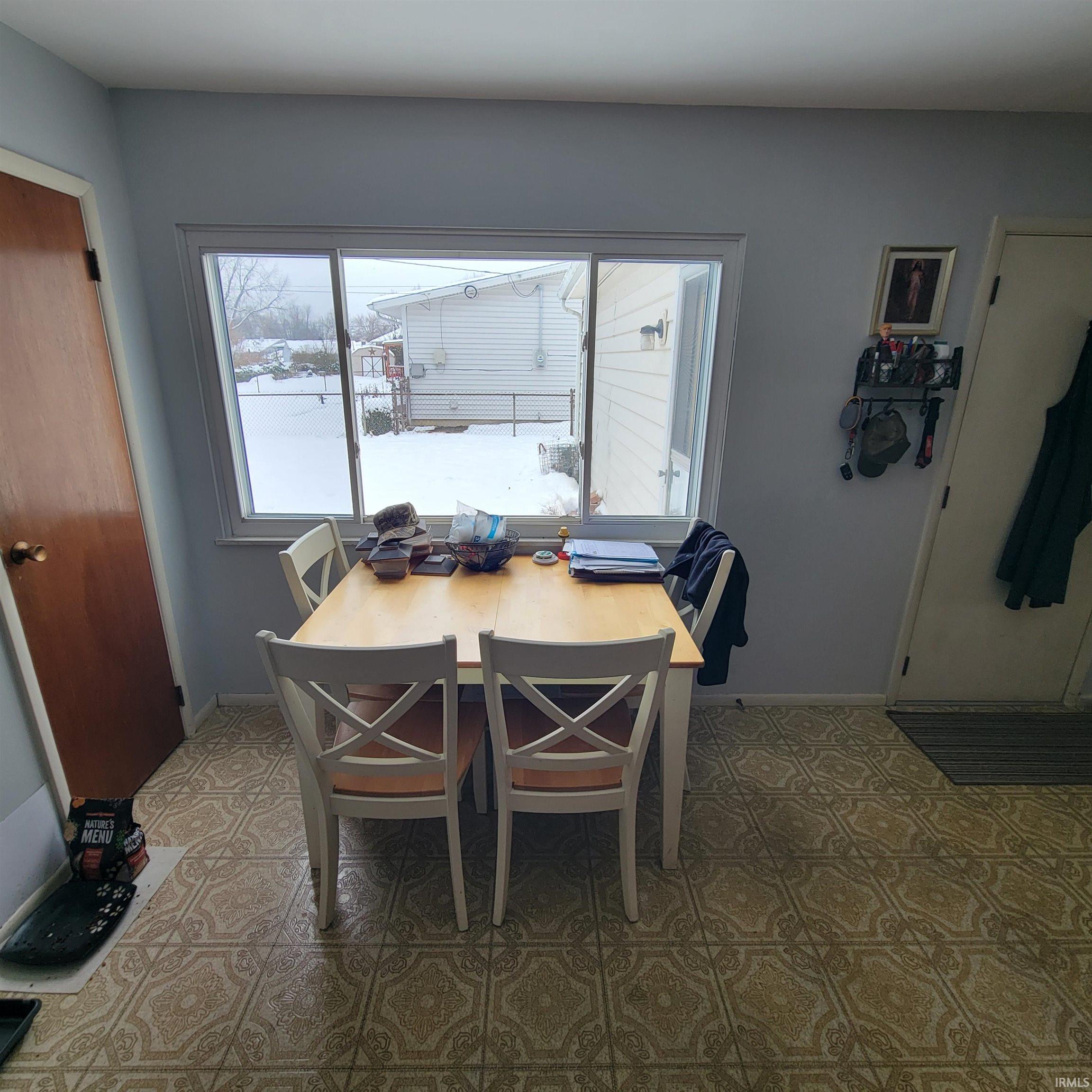 Dining space featuring light flooring