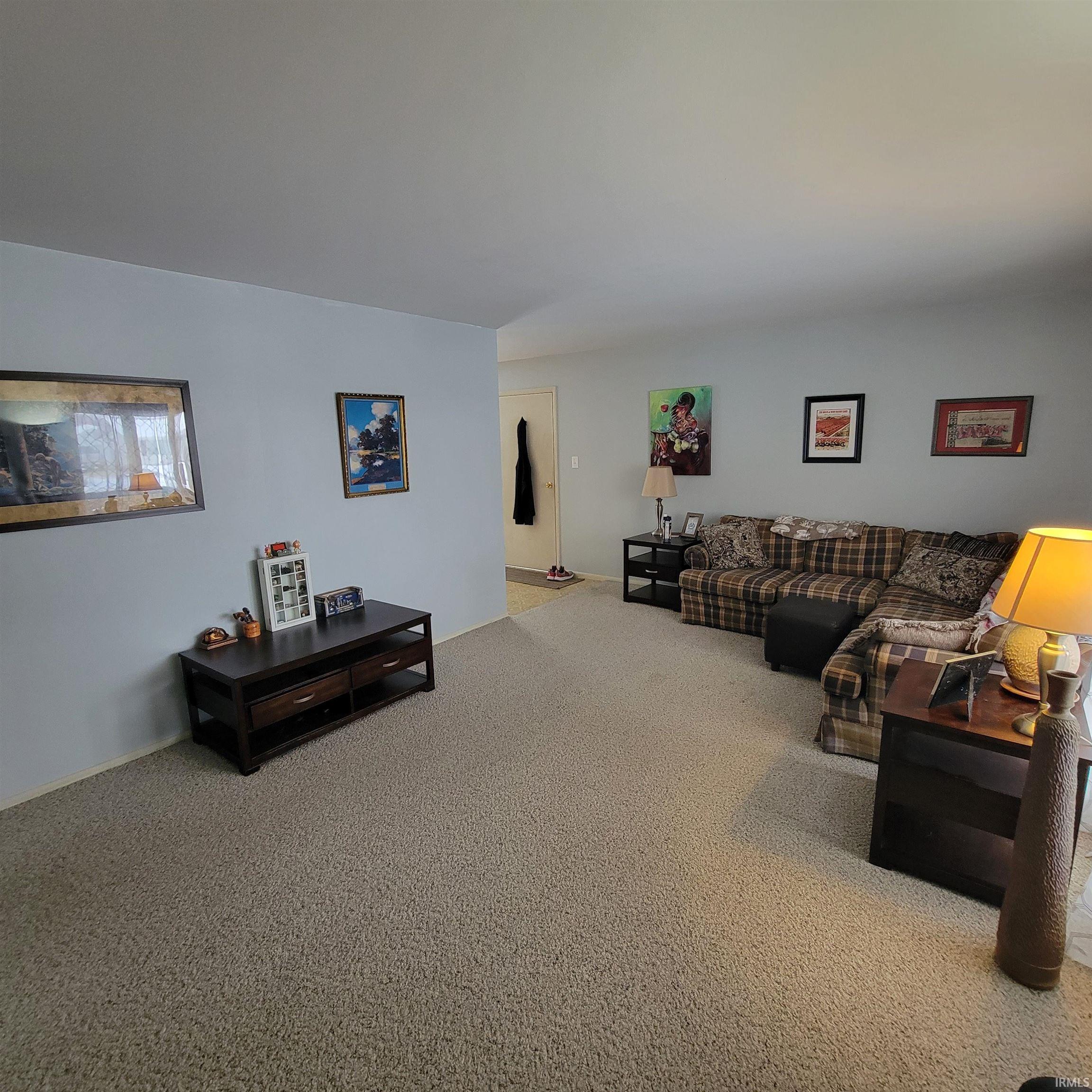 Living room featuring carpet floors
