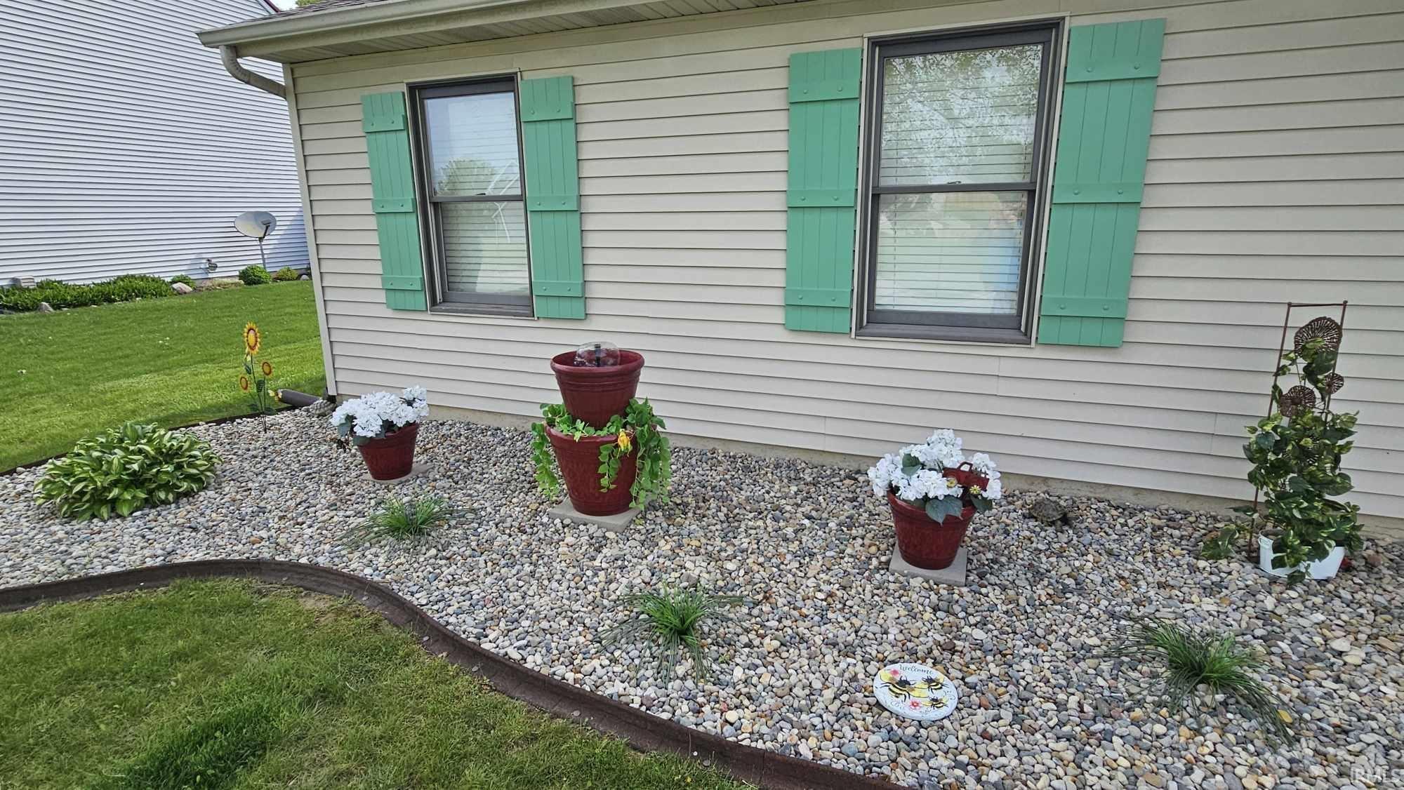 View of home's exterior with a yard