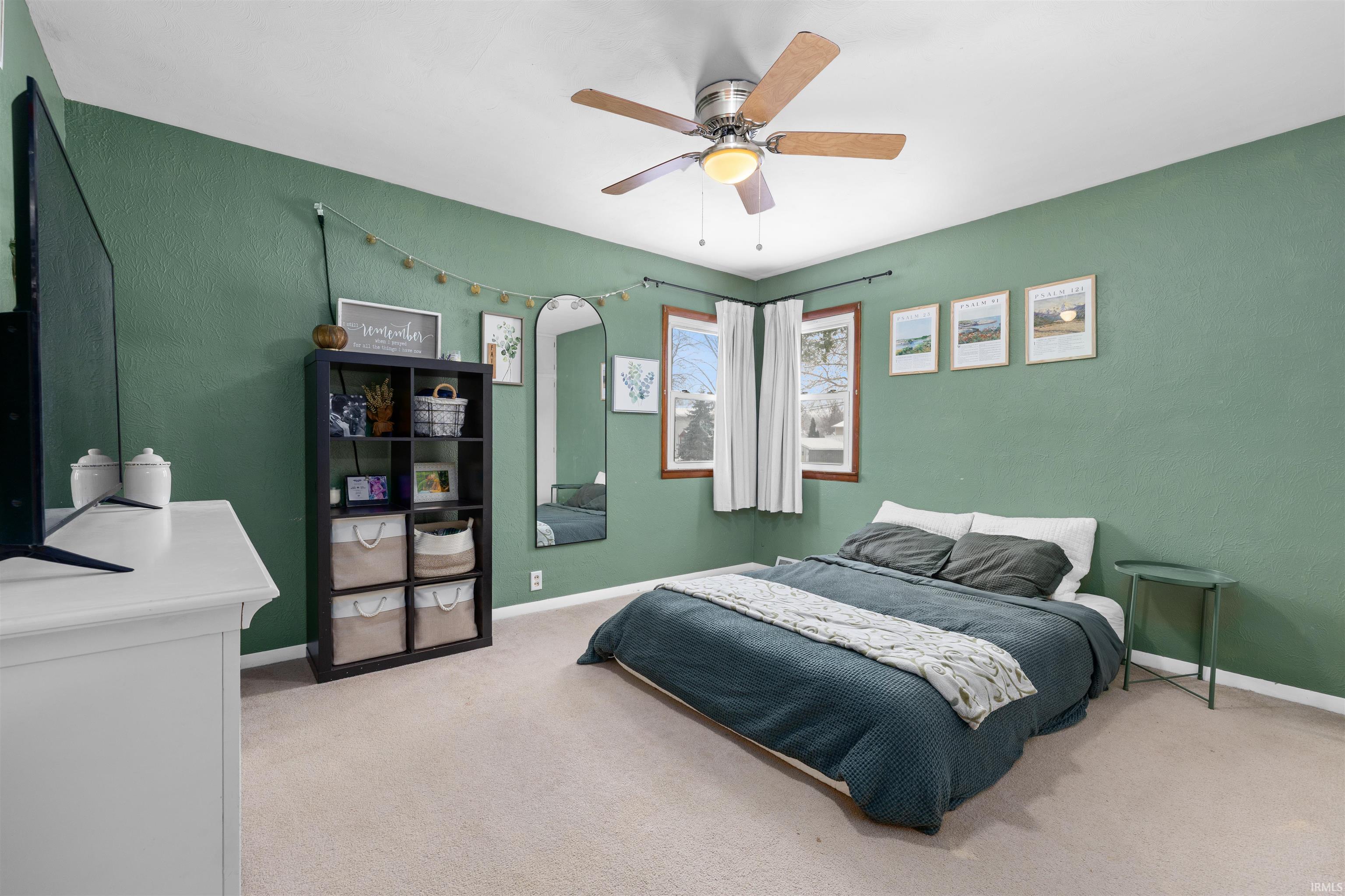 Bedroom with carpet and ceiling fan