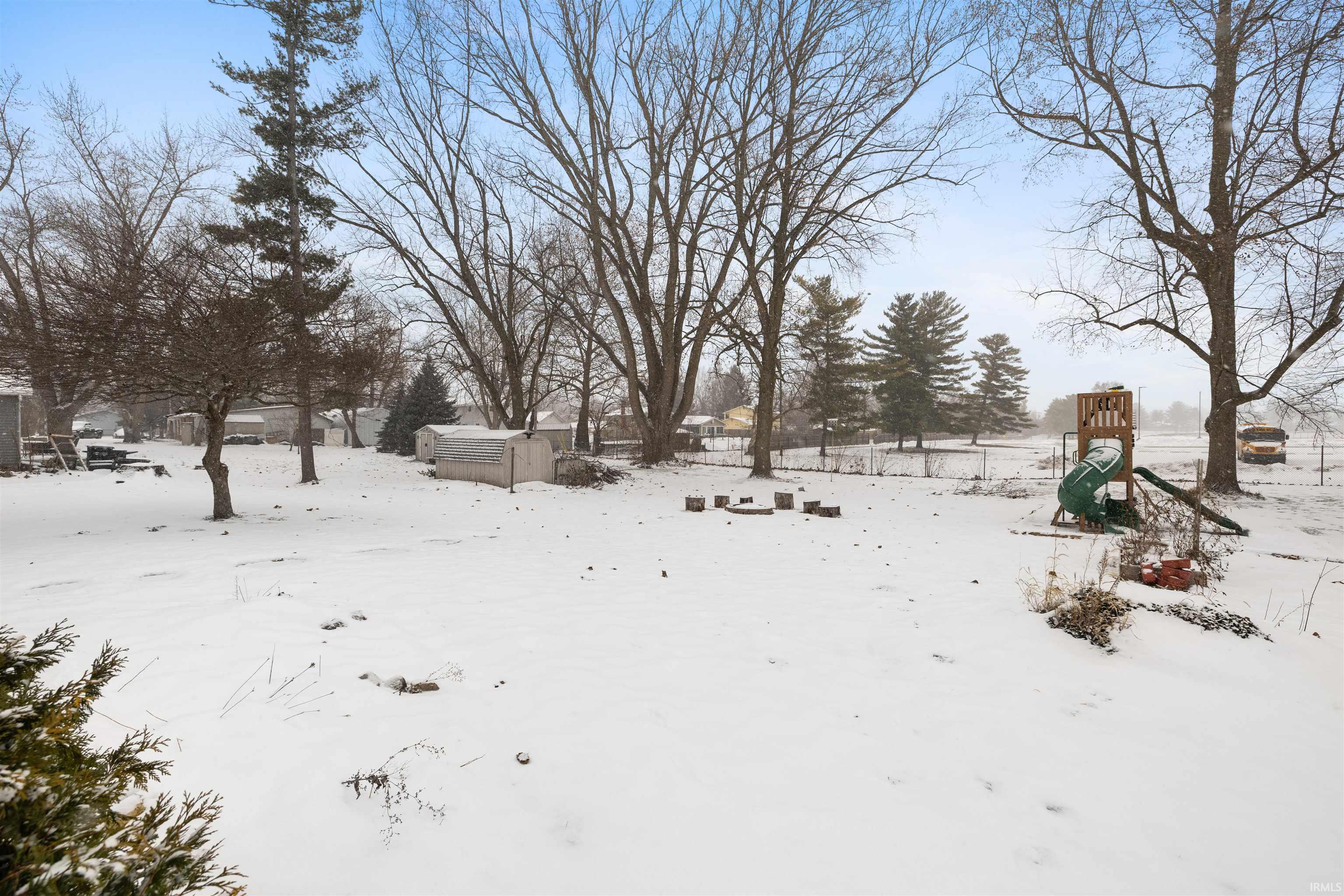 View of yard layered in snow