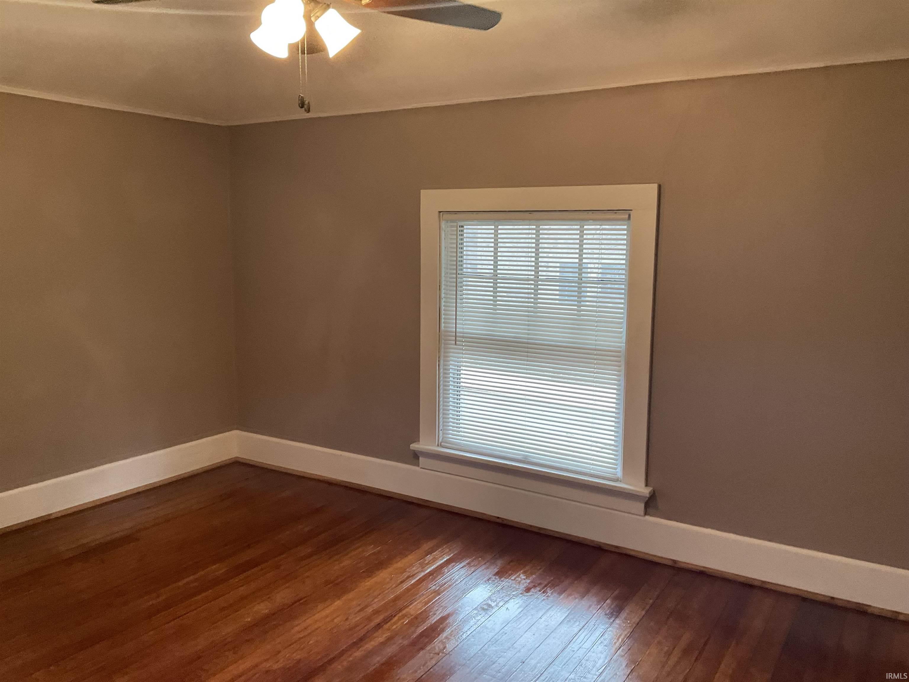 Bedroom with hardwood floors