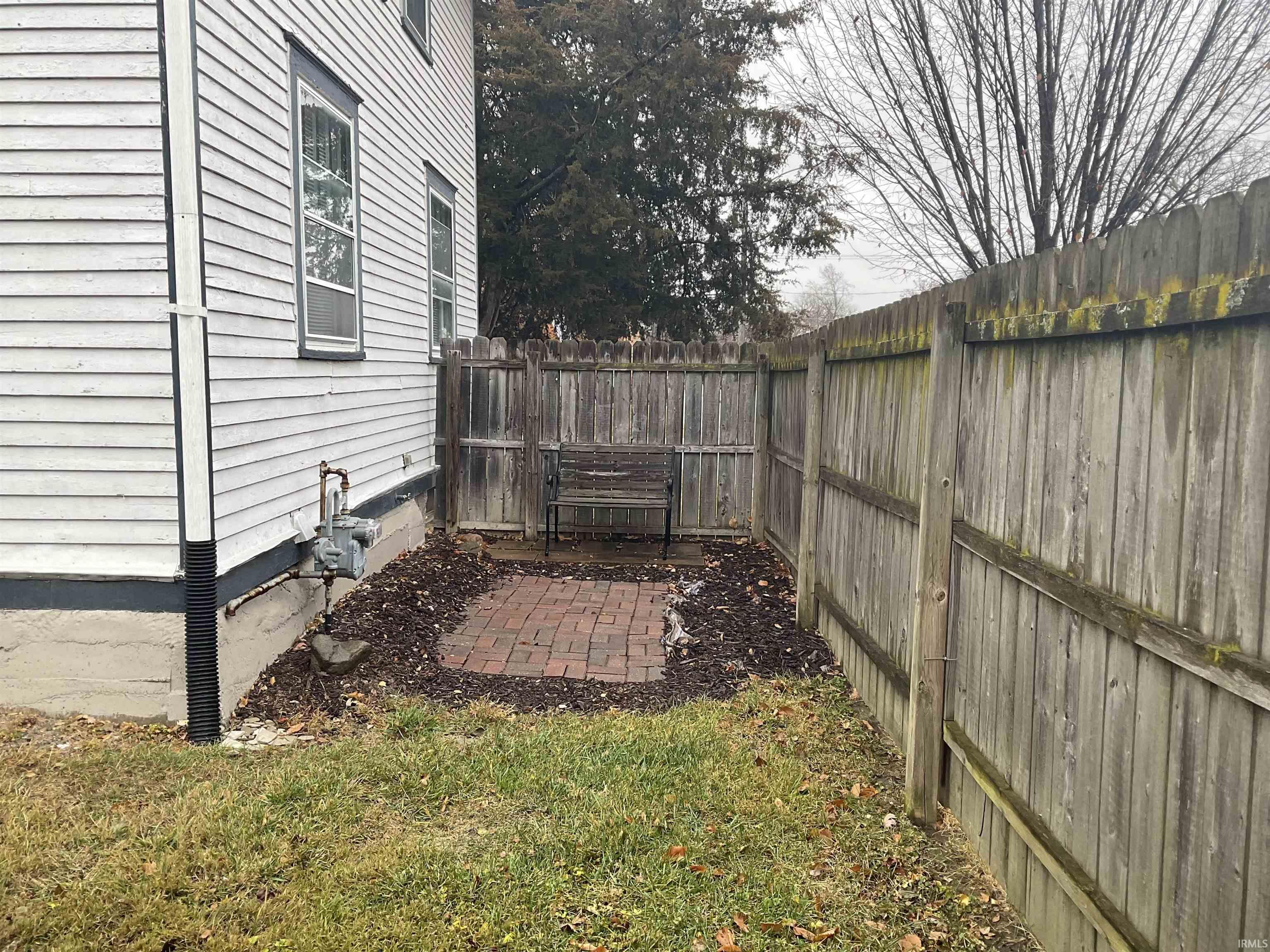 Fenced backyard featuring a patio