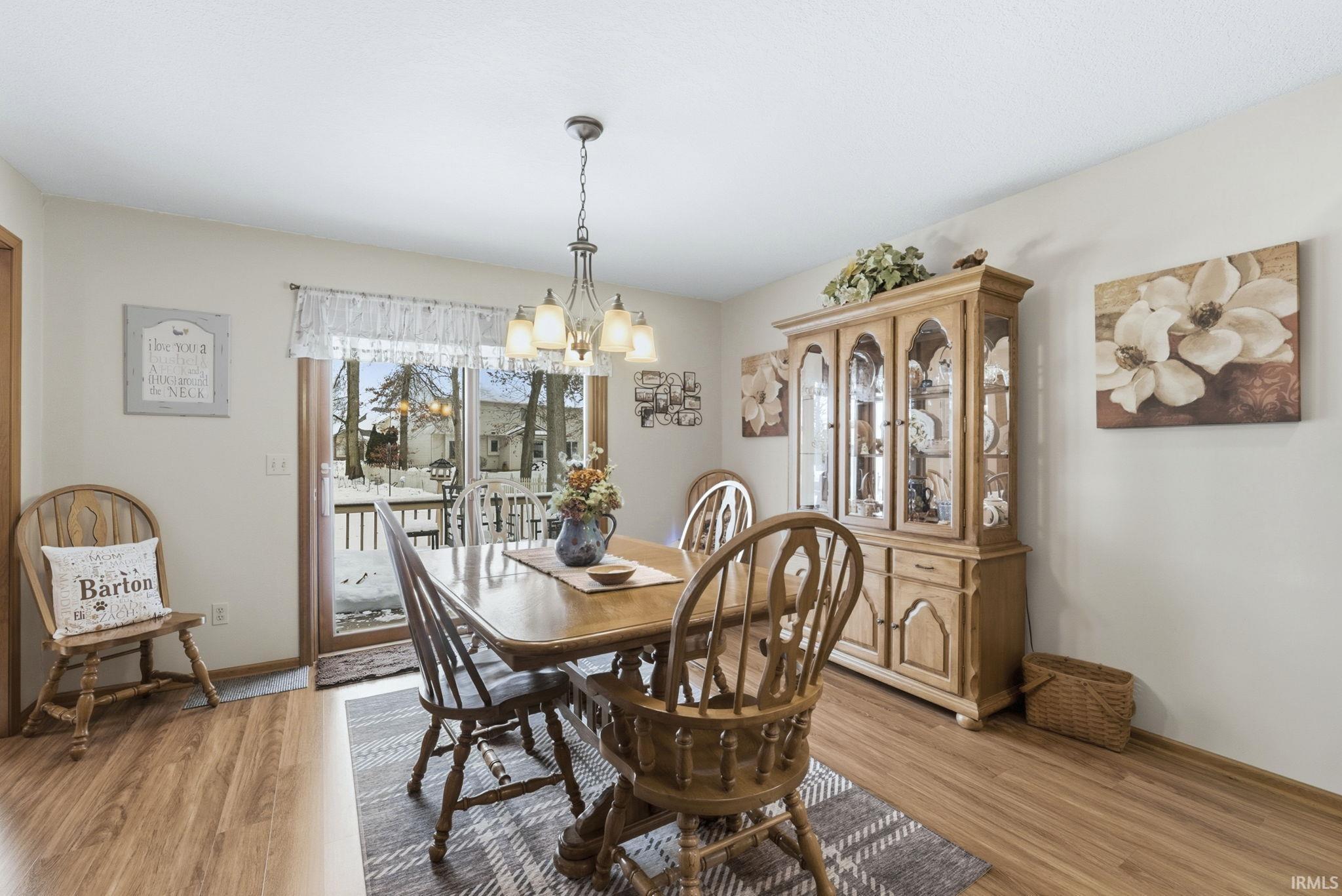 Dining area featuring a chandelier and light wood-style floors