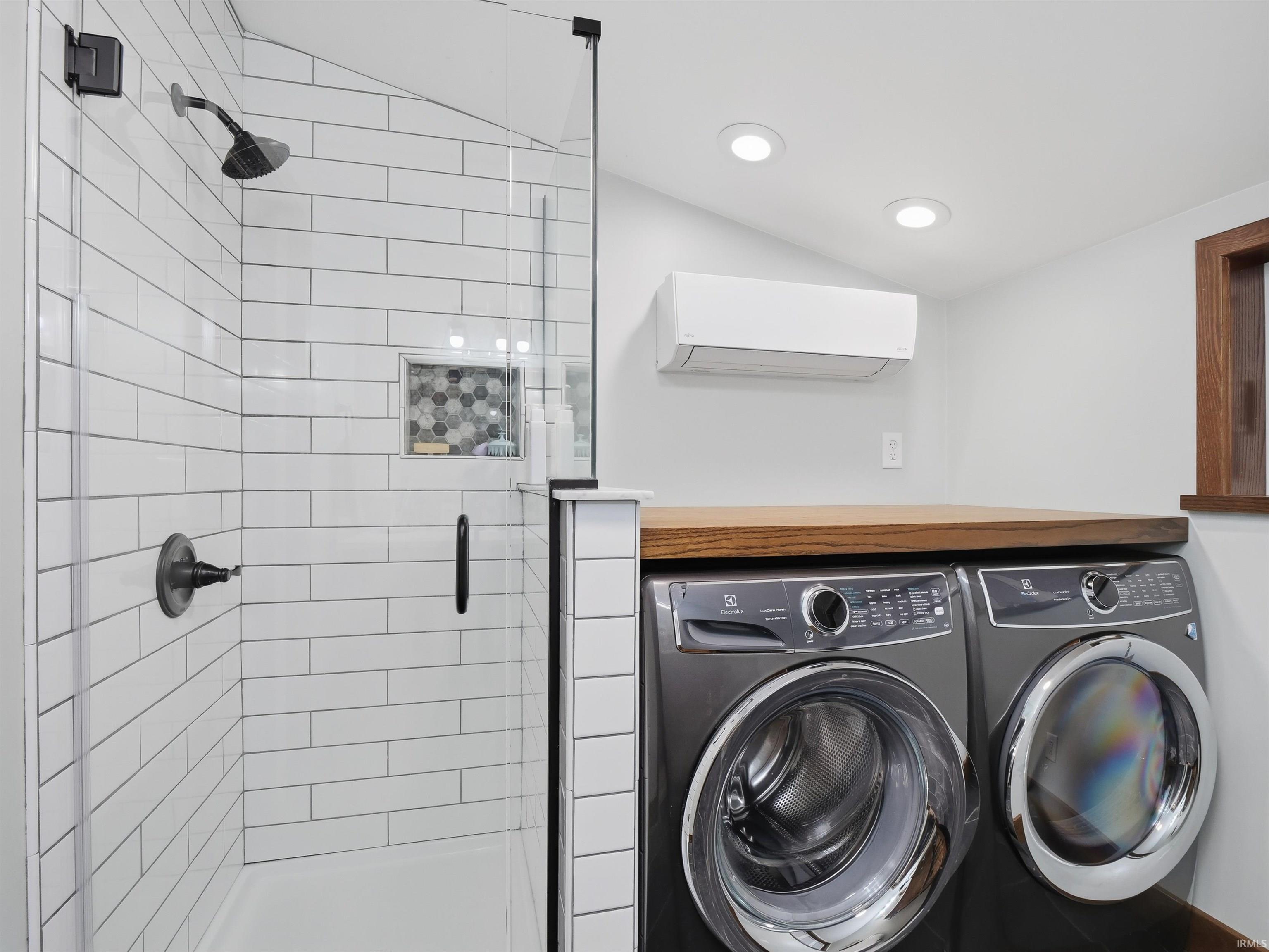 Laundry area with separate washer and dryer.