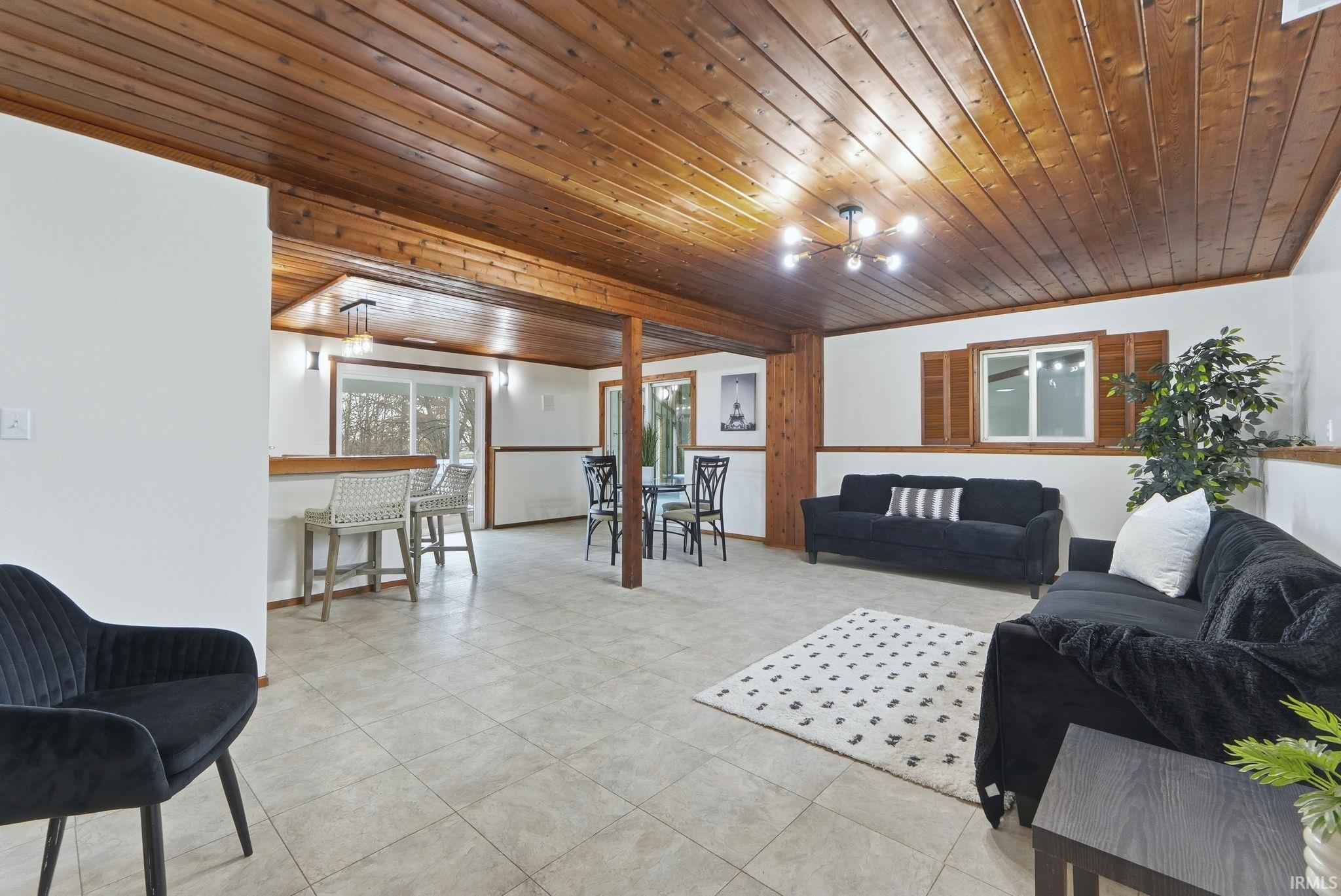 Living room with wooden ceiling