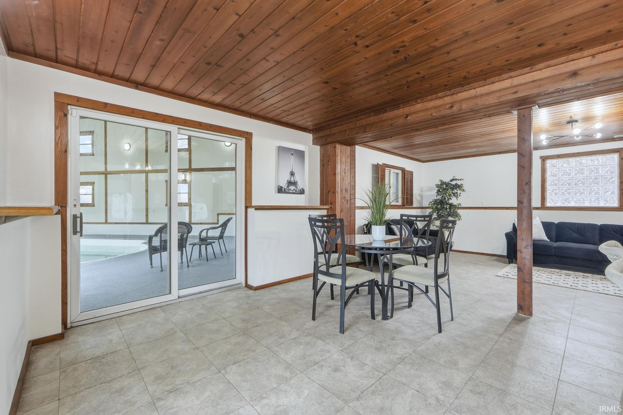 Dining space with wood ceiling