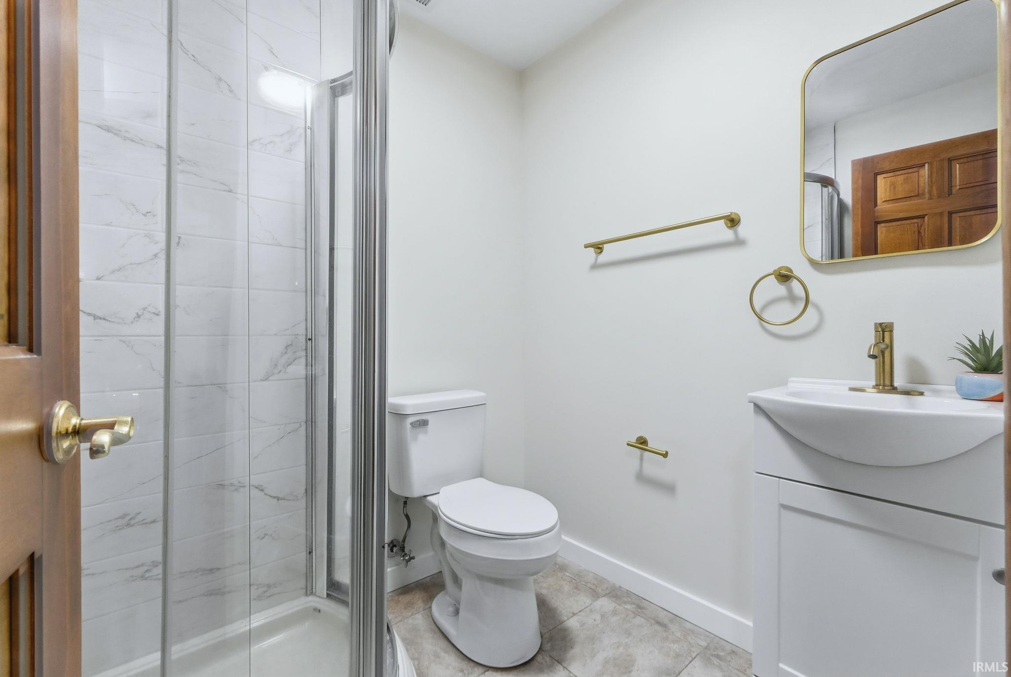Bathroom with vanity and a stall shower