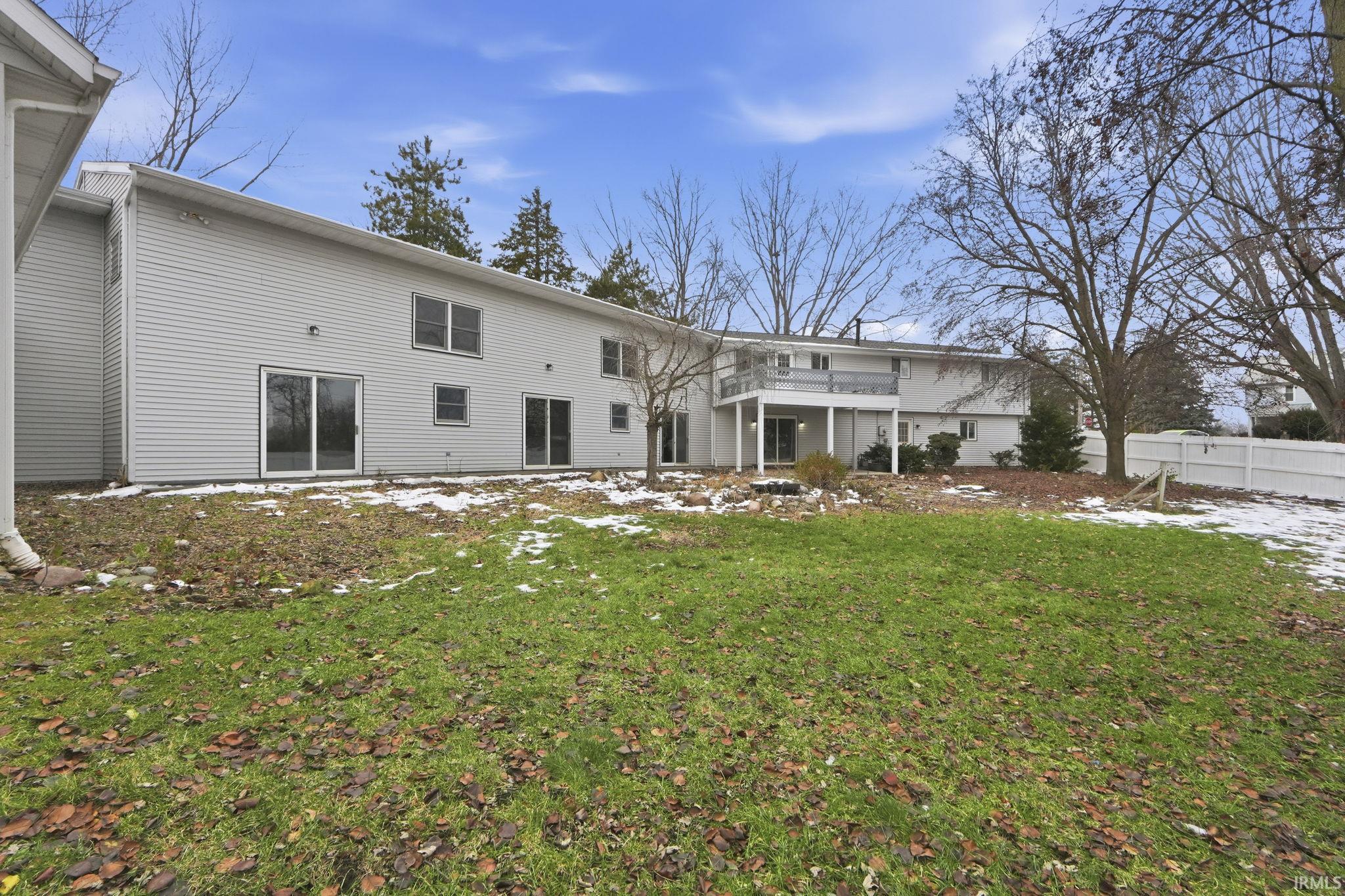 Back of property with a patio