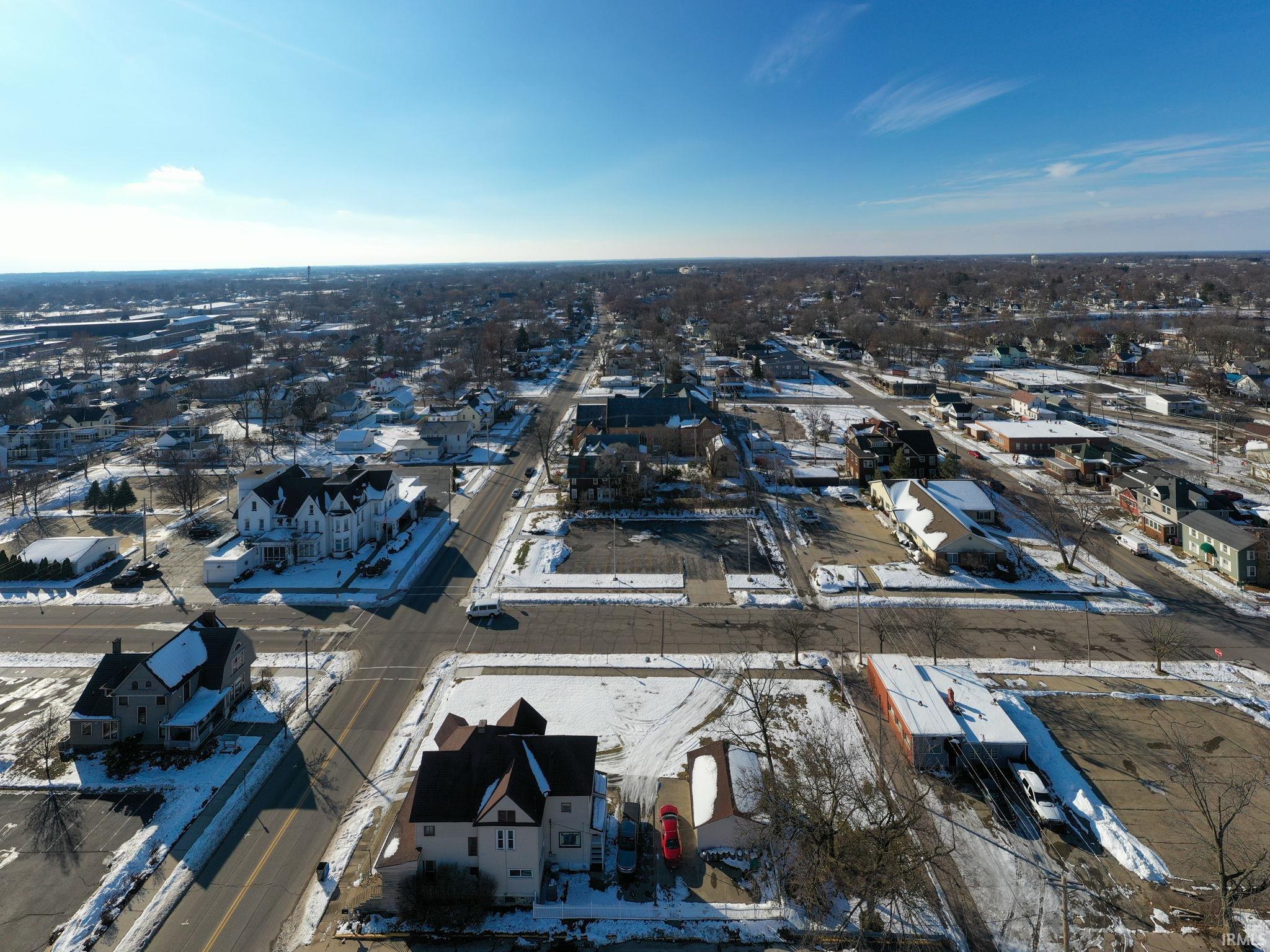 Snowy aerial view featuring a residential view