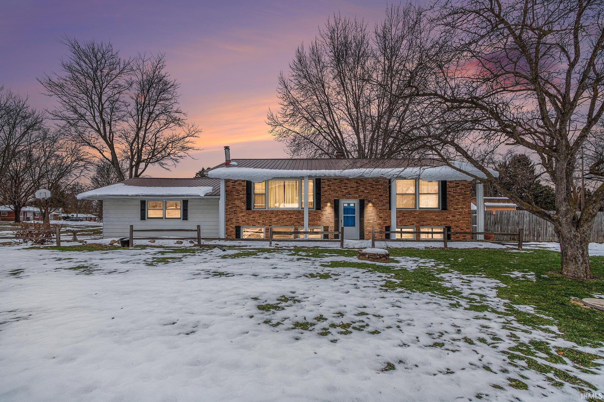 Split foyer home with brick siding