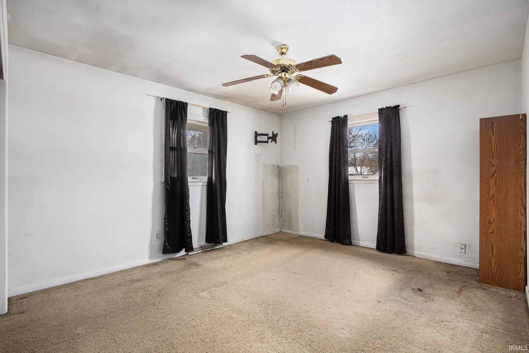Spare room with ceiling fan