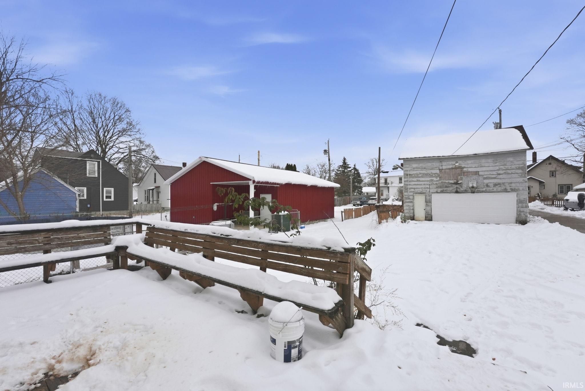View of yard layered in snow