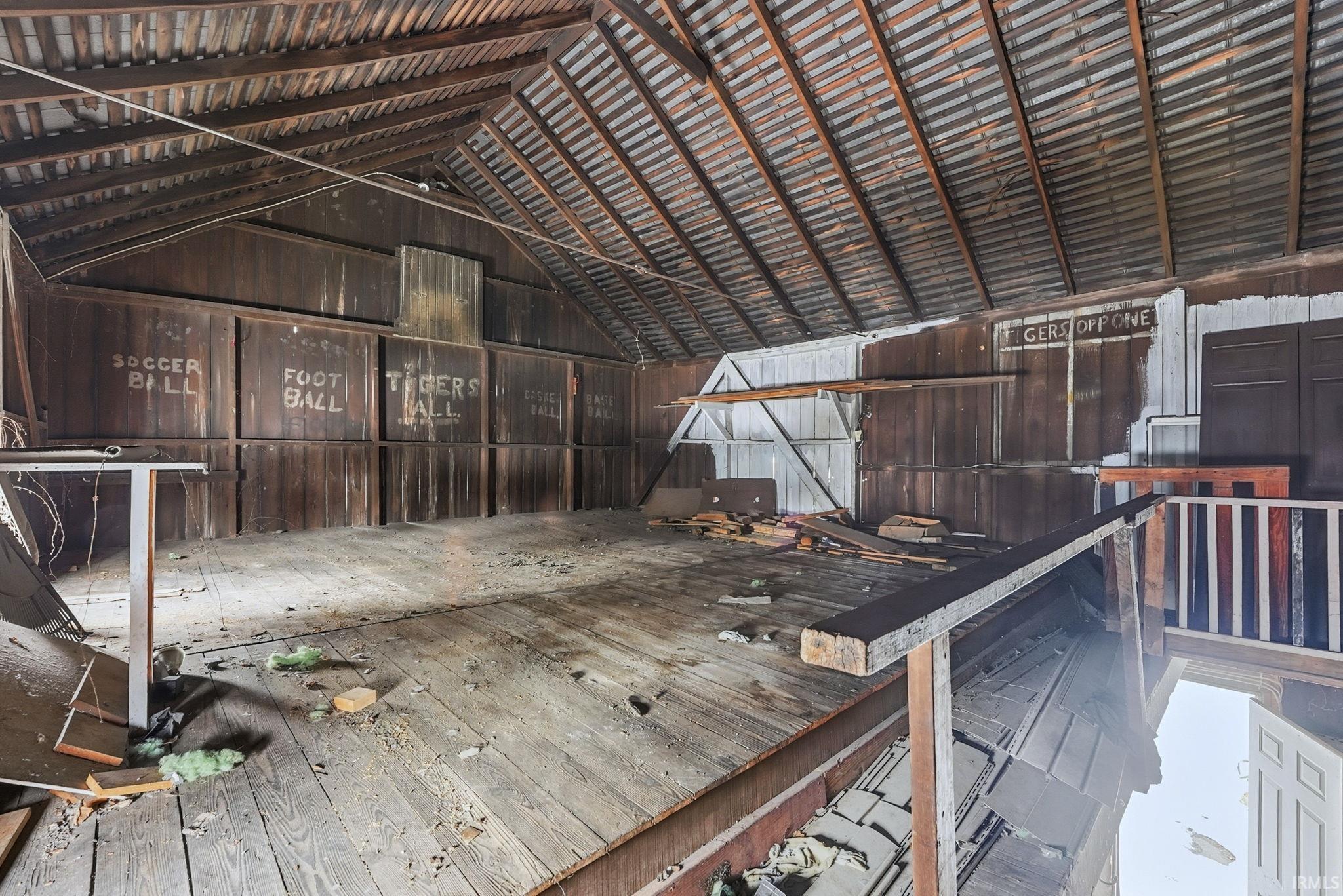 Miscellaneous room featuring lofted ceiling