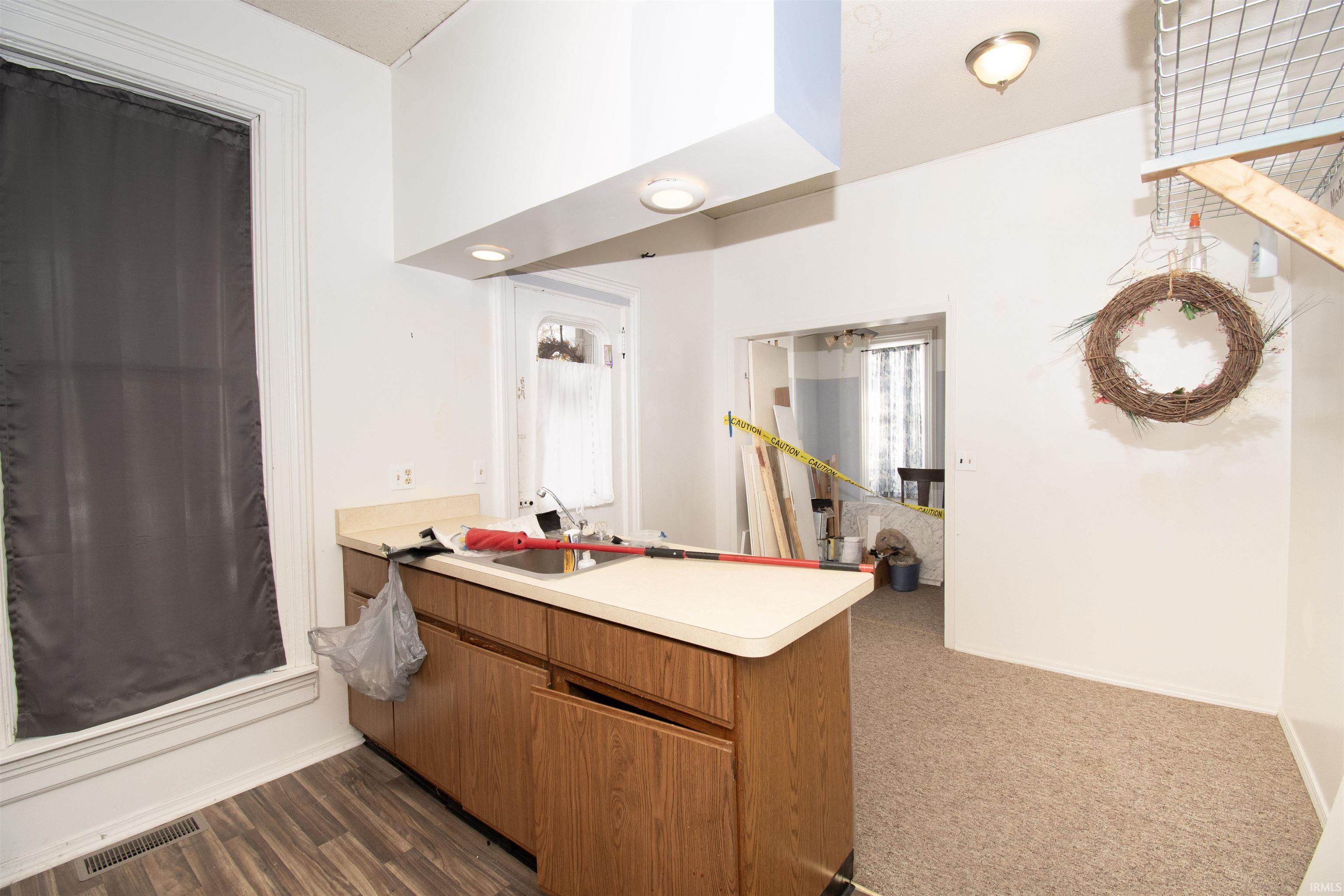 Full bathroom featuring vanity and baseboards