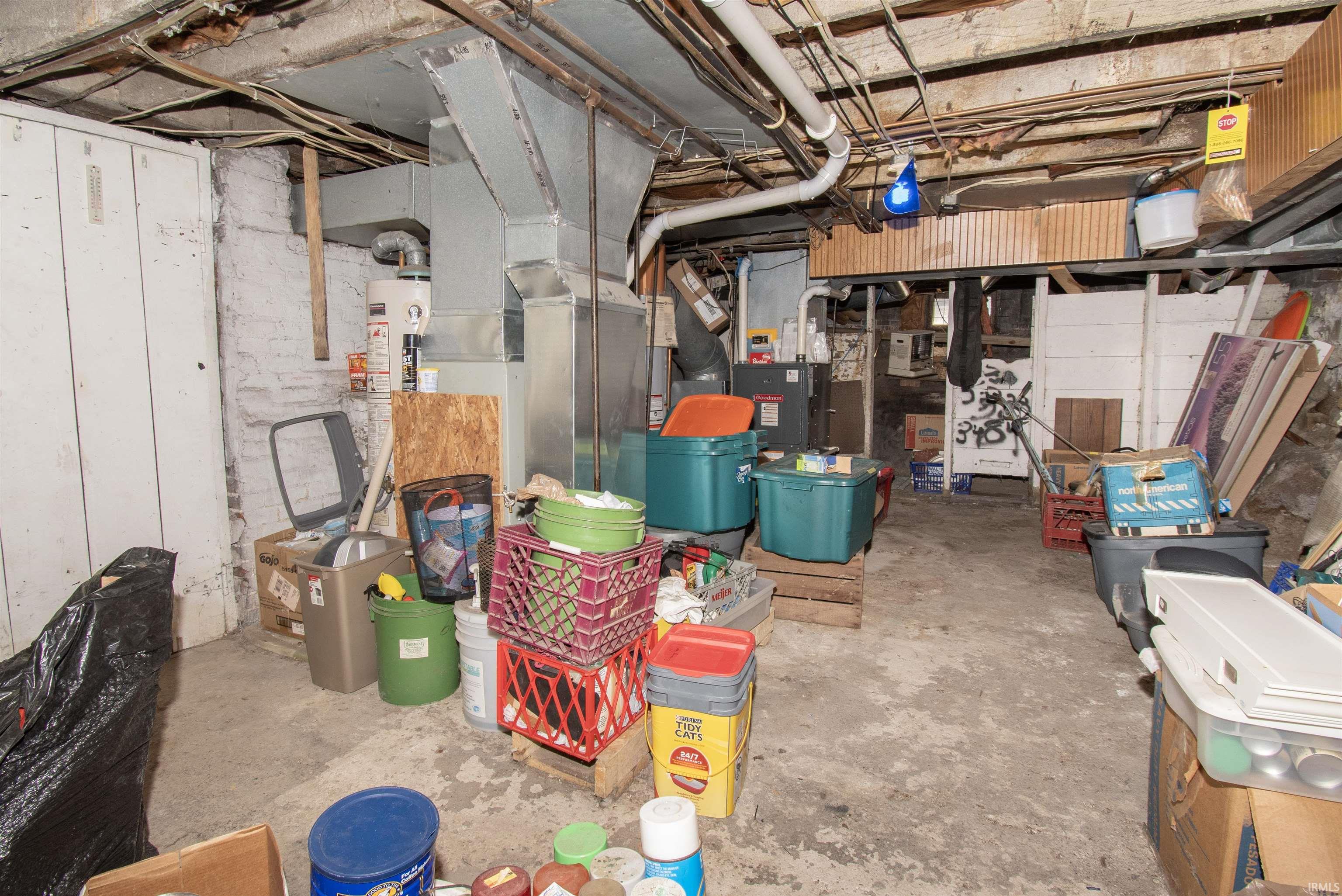 Unfinished basement featuring heating unit