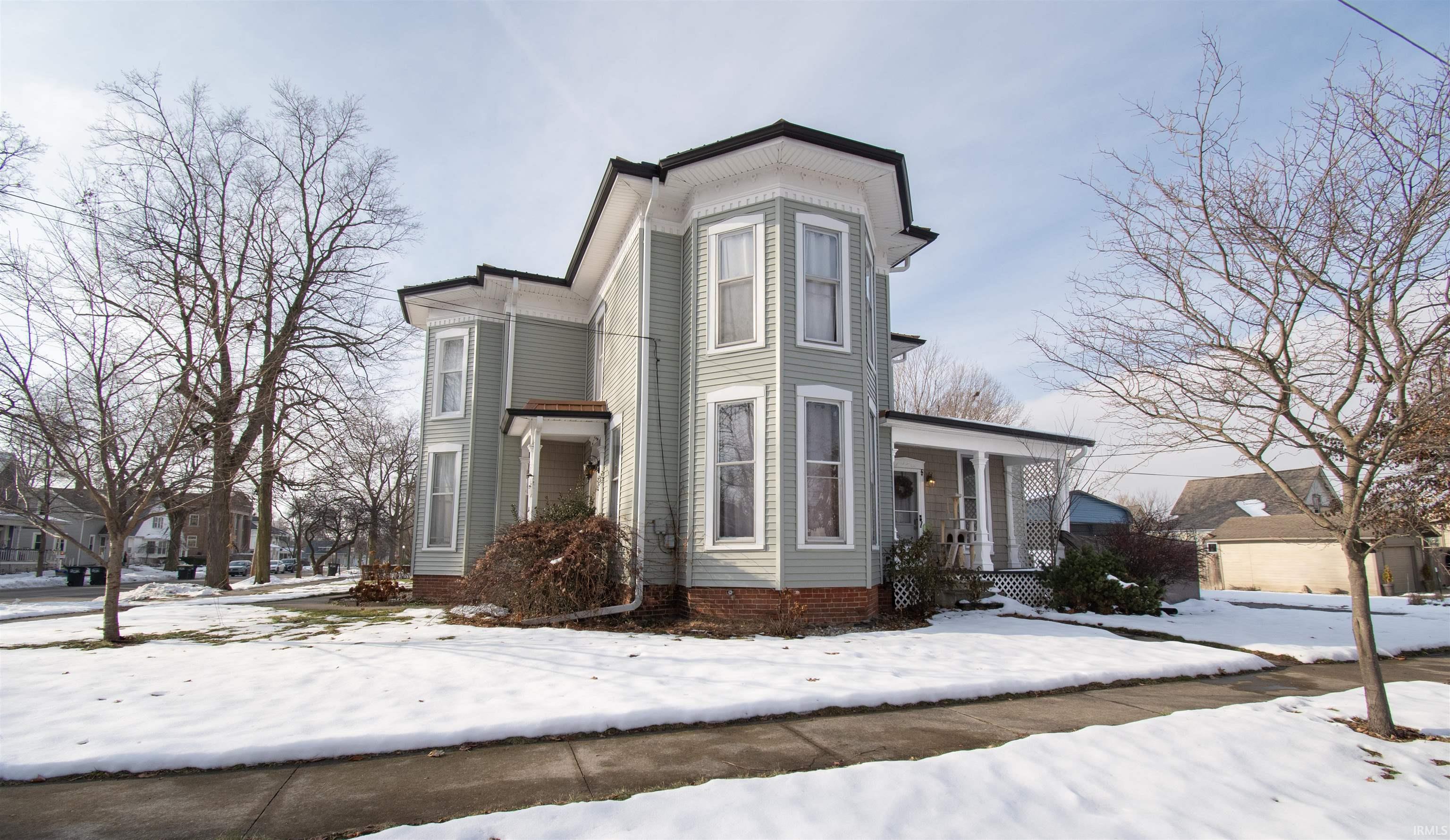 View of front of house with covered porch