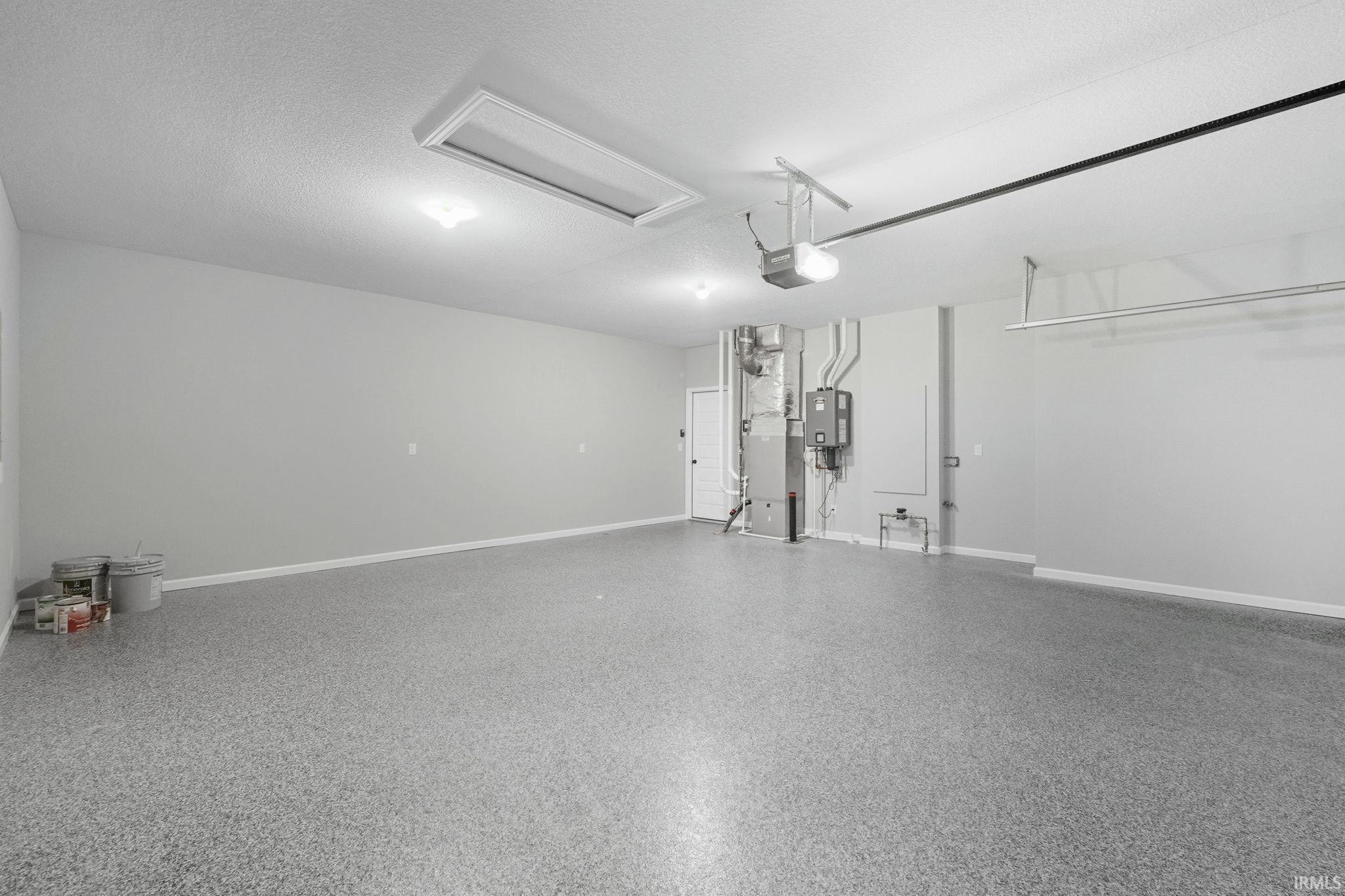 Garage with heating unit and baseboards