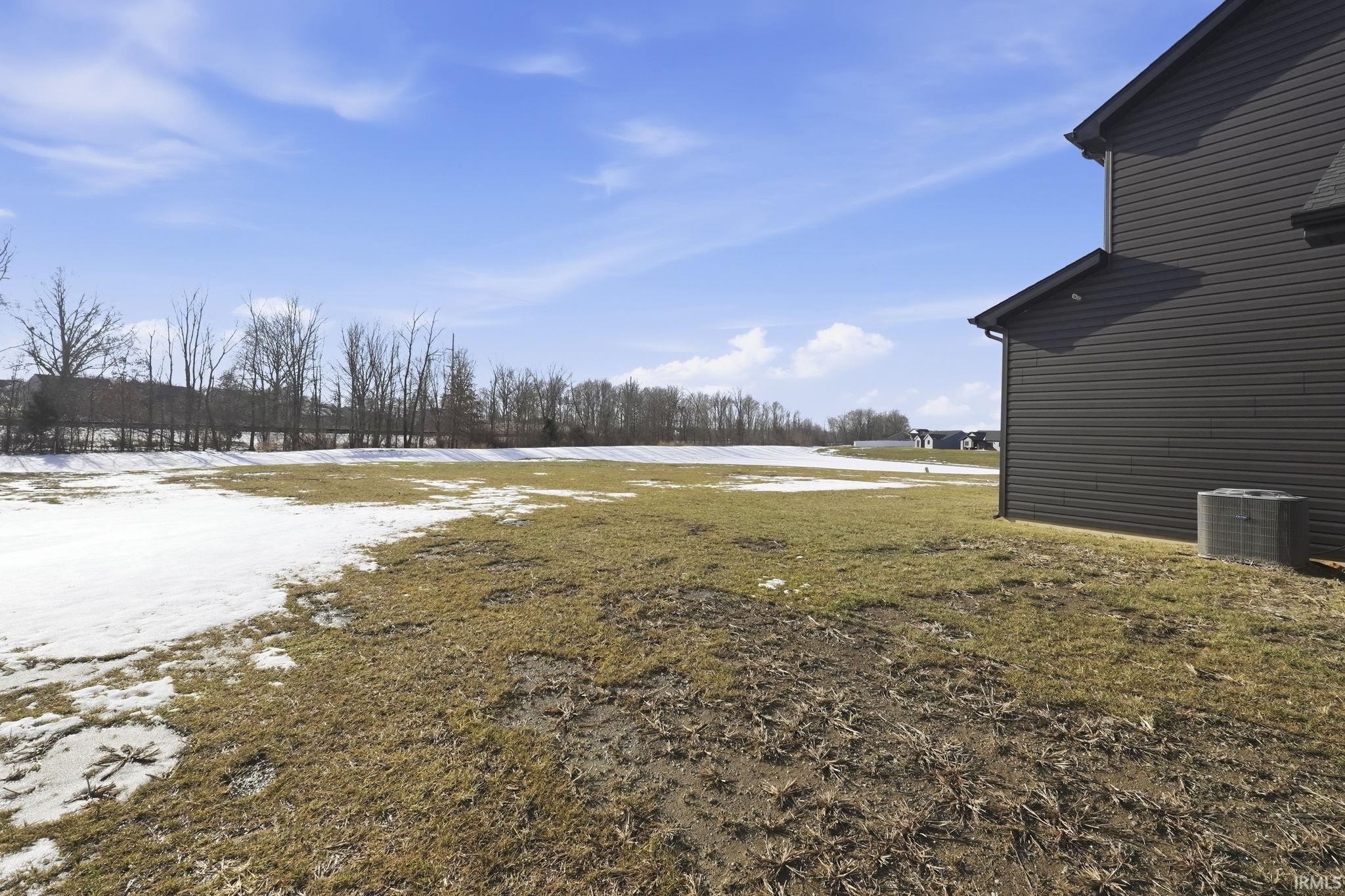Yard covered in snow with a yard