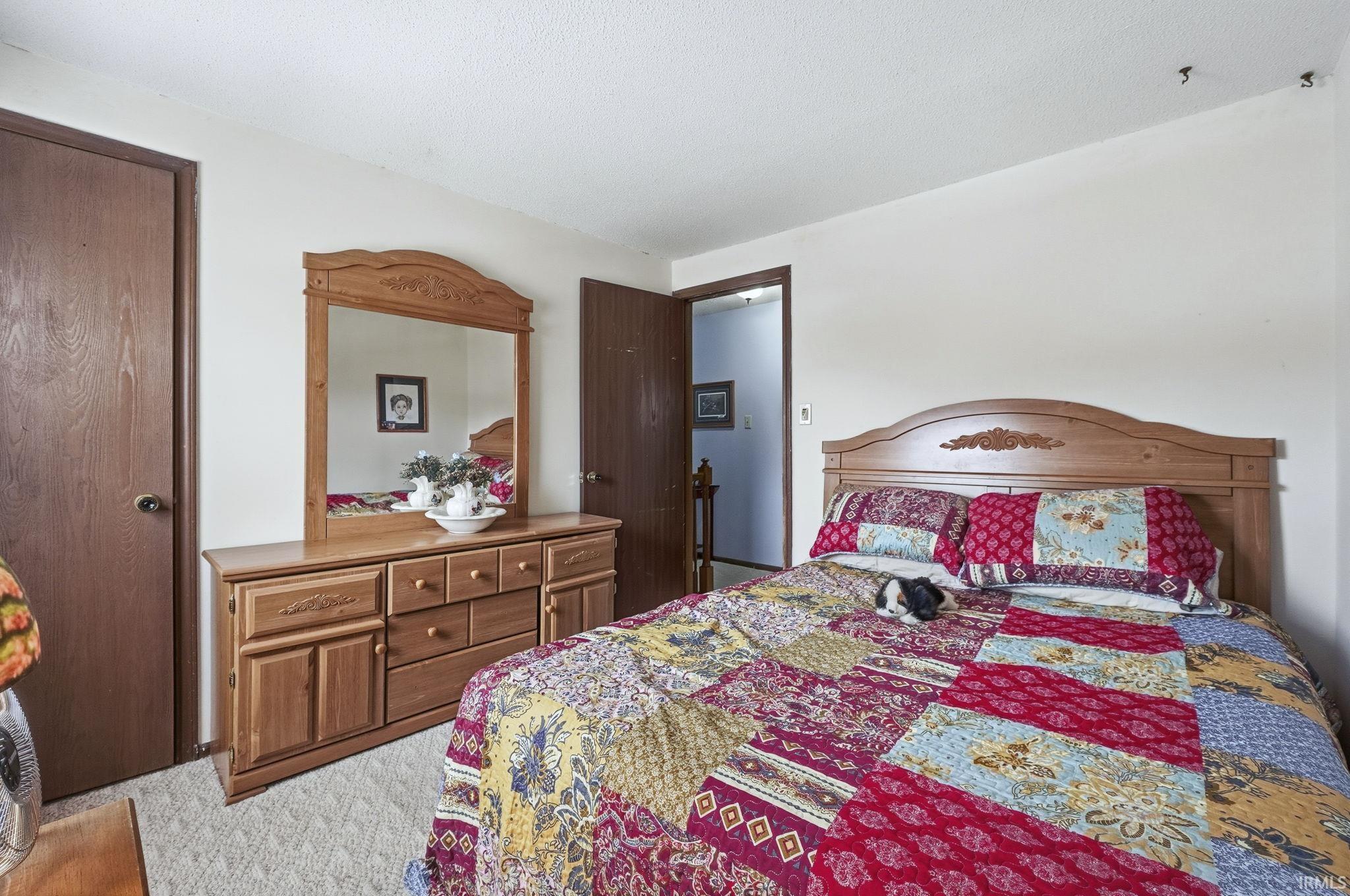 Bedroom with carpet flooring