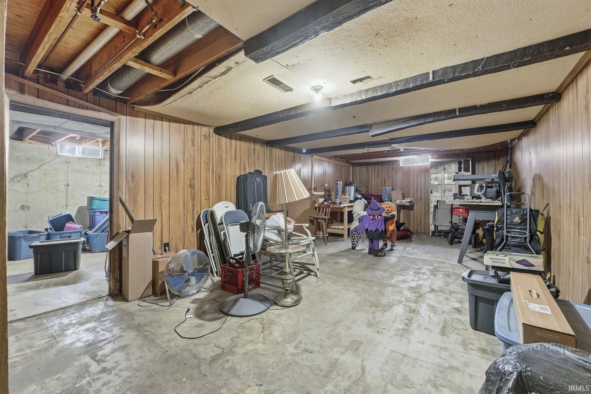 Unfinished below grade area with wooden walls