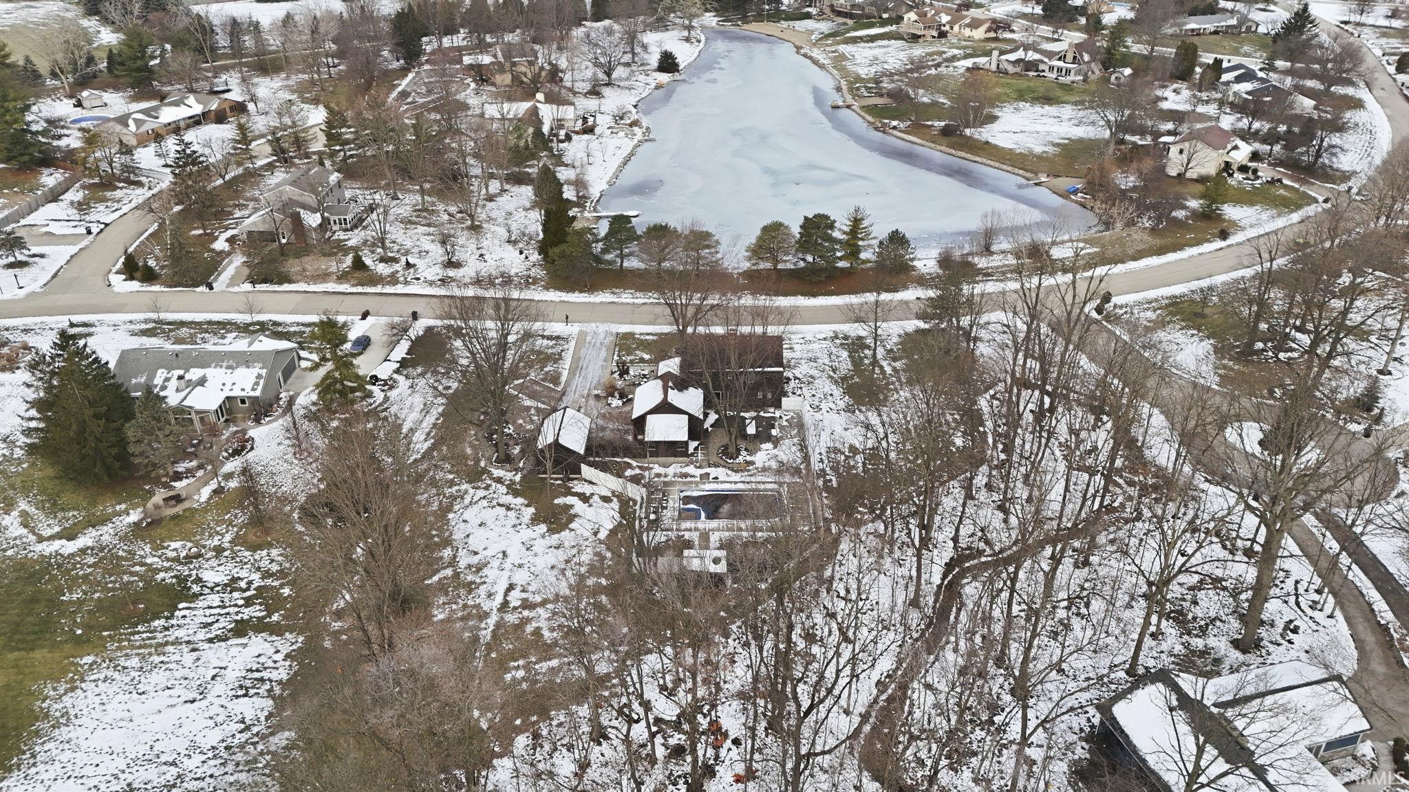 Snowy aerial view with a residential view
