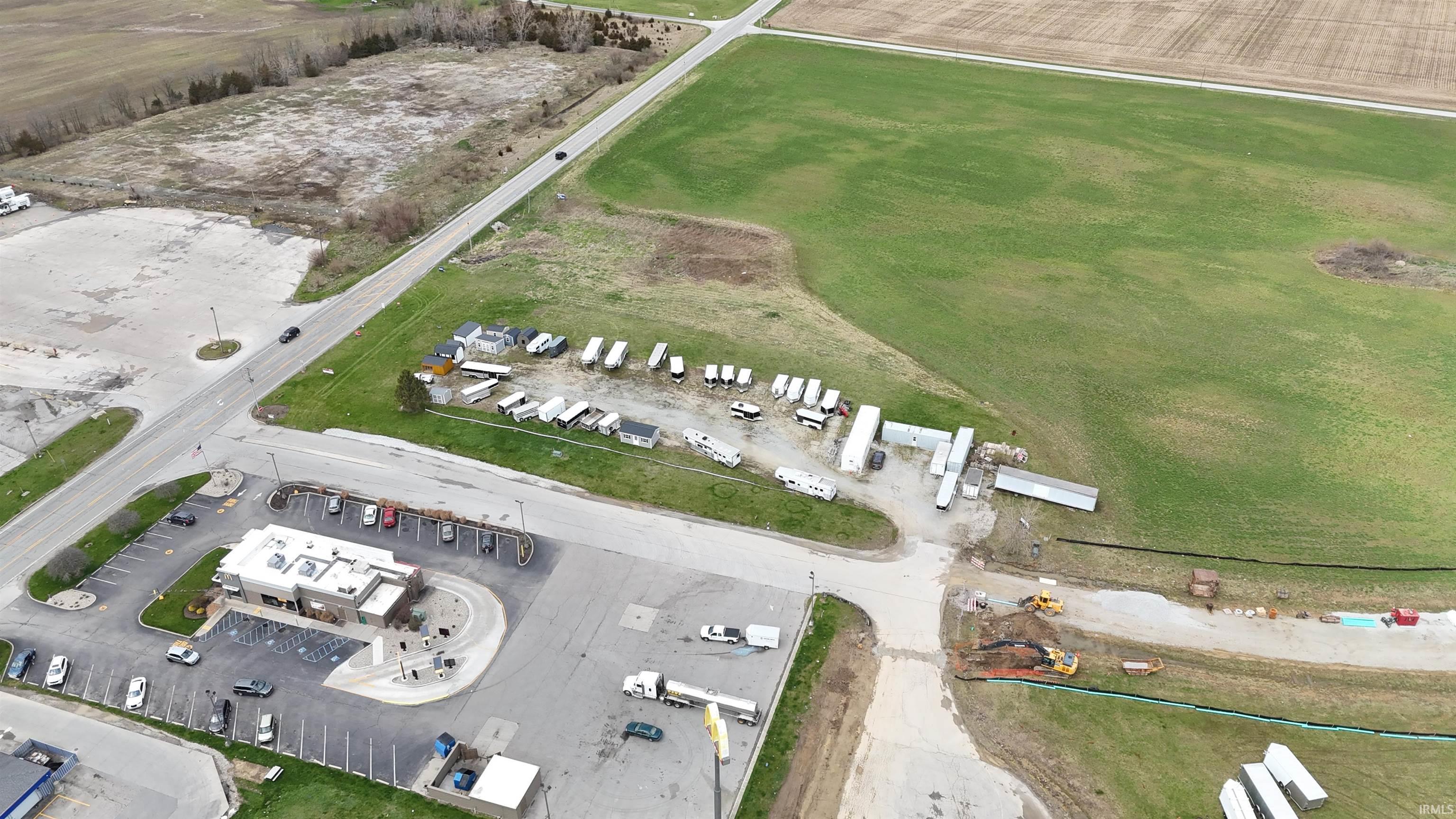 Aerial overview of property's location featuring an industrial area