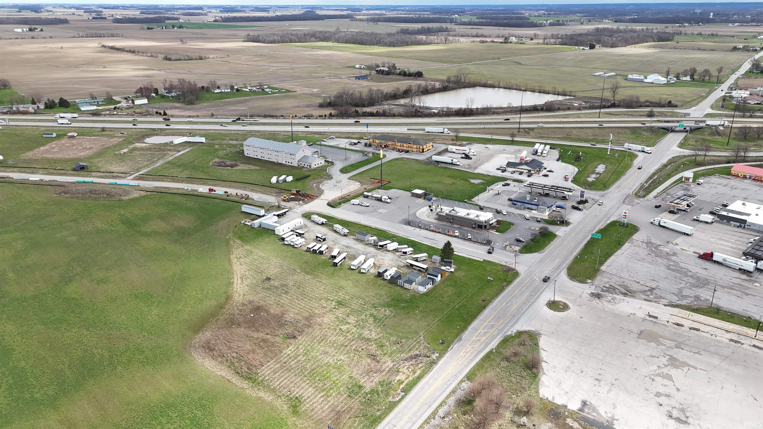 Aerial overview of property's location featuring industrial structures