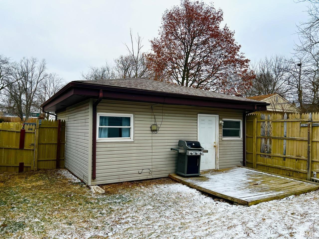 View of outdoor structure with a gate