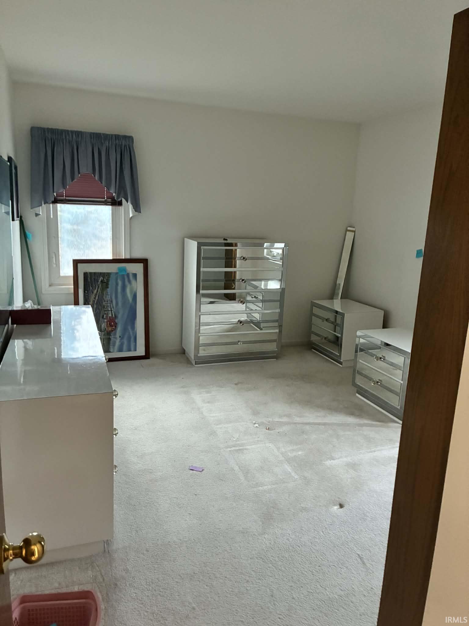 Miscellaneous room featuring light carpet