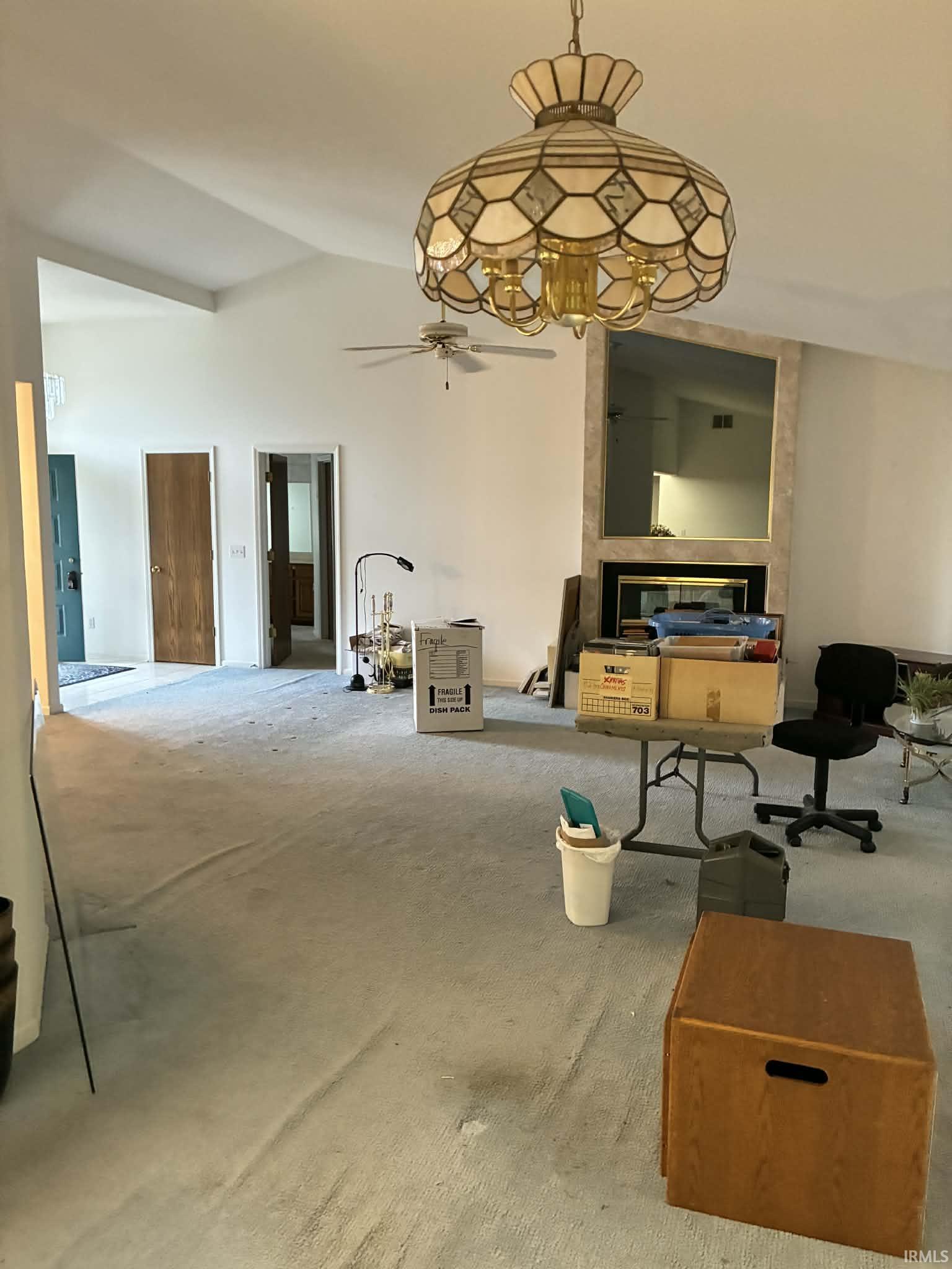 Living room with vaulted ceiling and ceiling fan