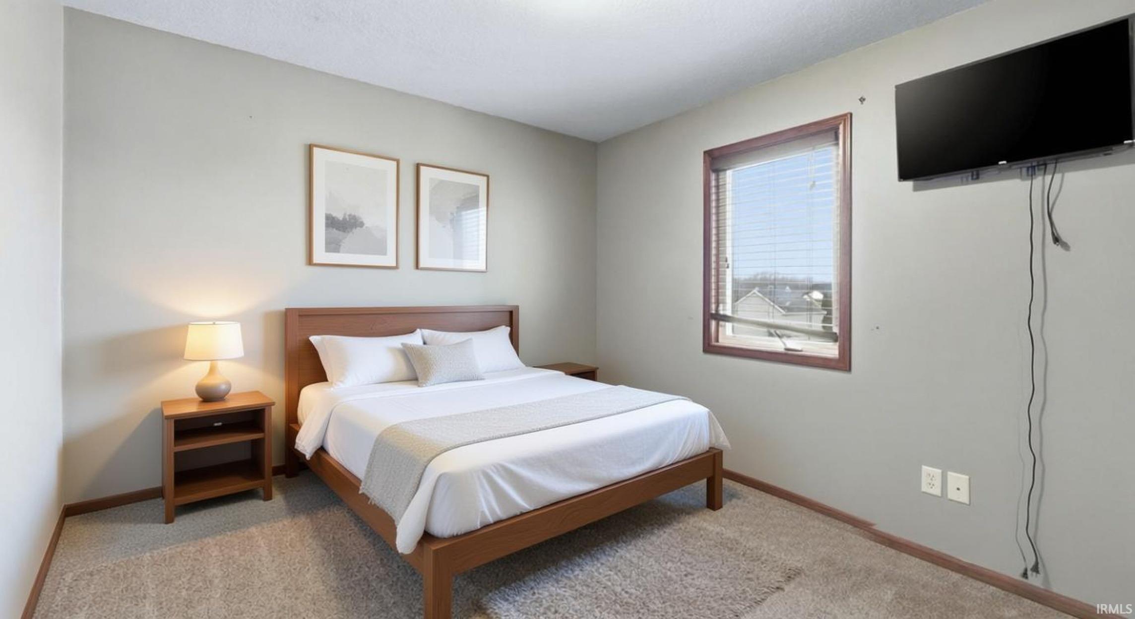 Bedroom with light carpet