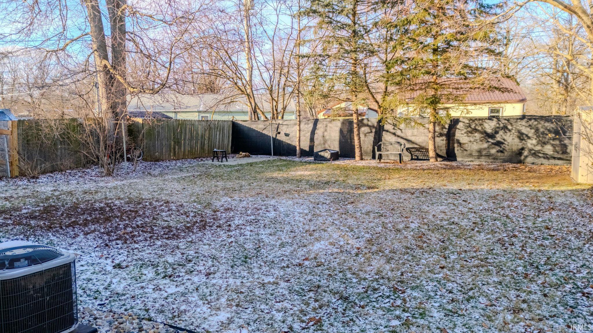 View of fenced backyard