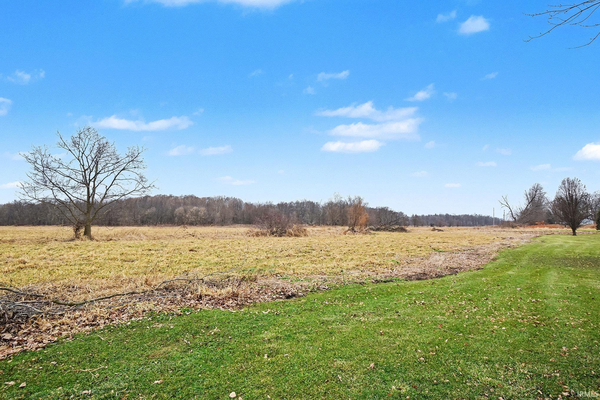 View of grassy yard featuring a view of rural / pastoral area