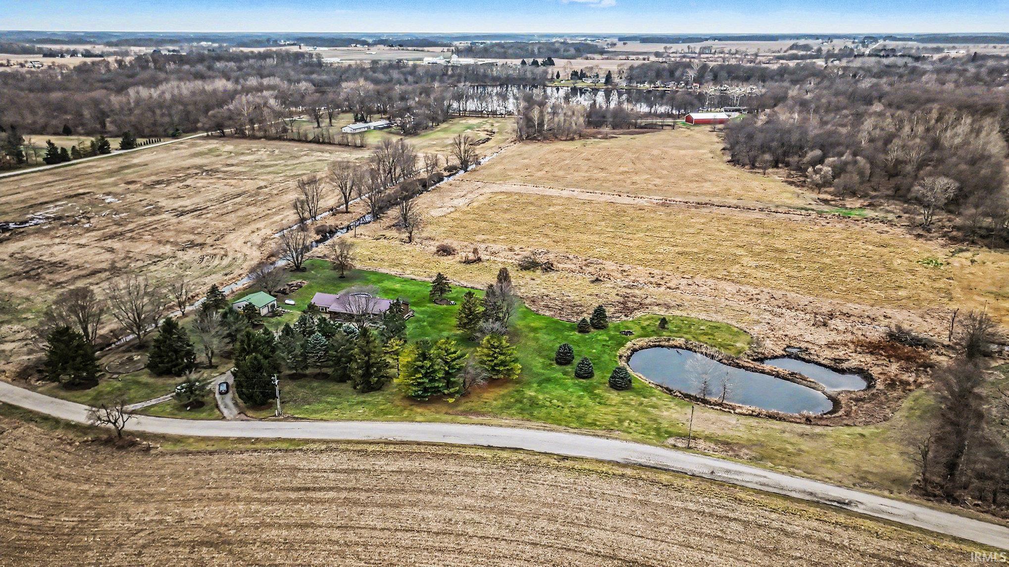 Aerial view of property and surrounding area with rural landscape