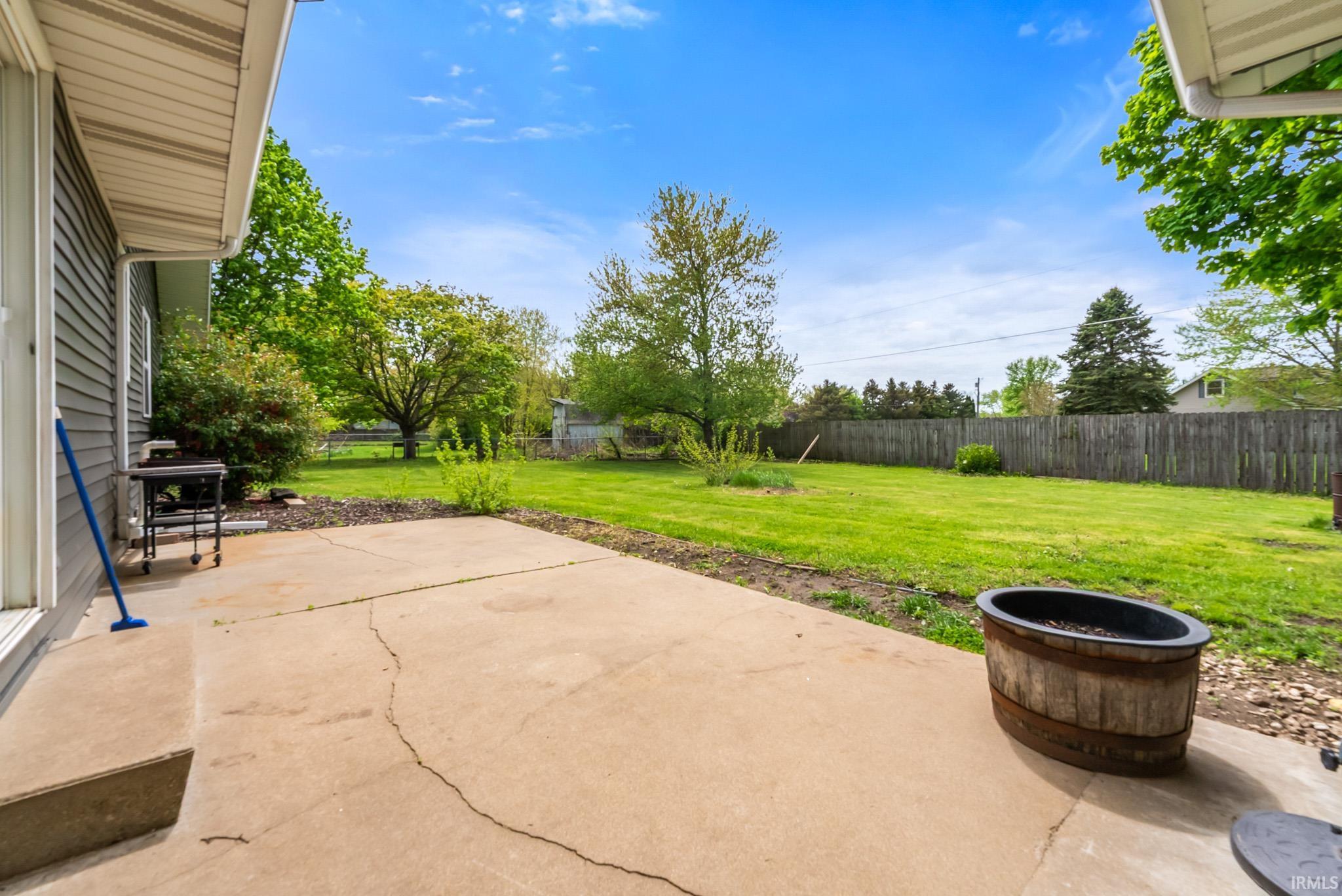 Fenced backyard featuring a patio area