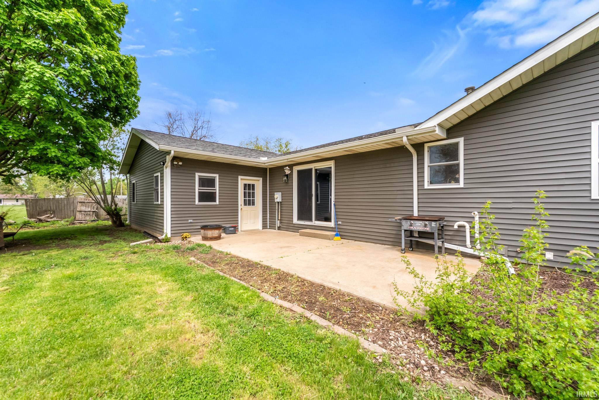 Back of property featuring a patio area